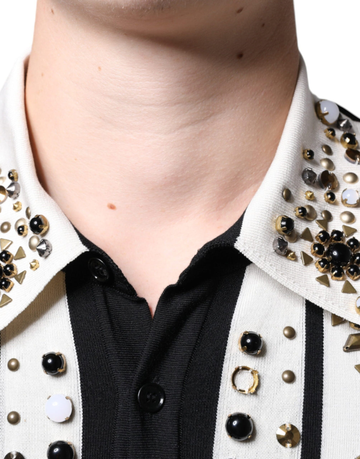 Indulge in the exquisite Dolce & Gabbana Silk Studded Stone Crystal Shirt, where luxurious silk meets meticulous craftsmanship, embodying timeless elegance for the discerning individual.
