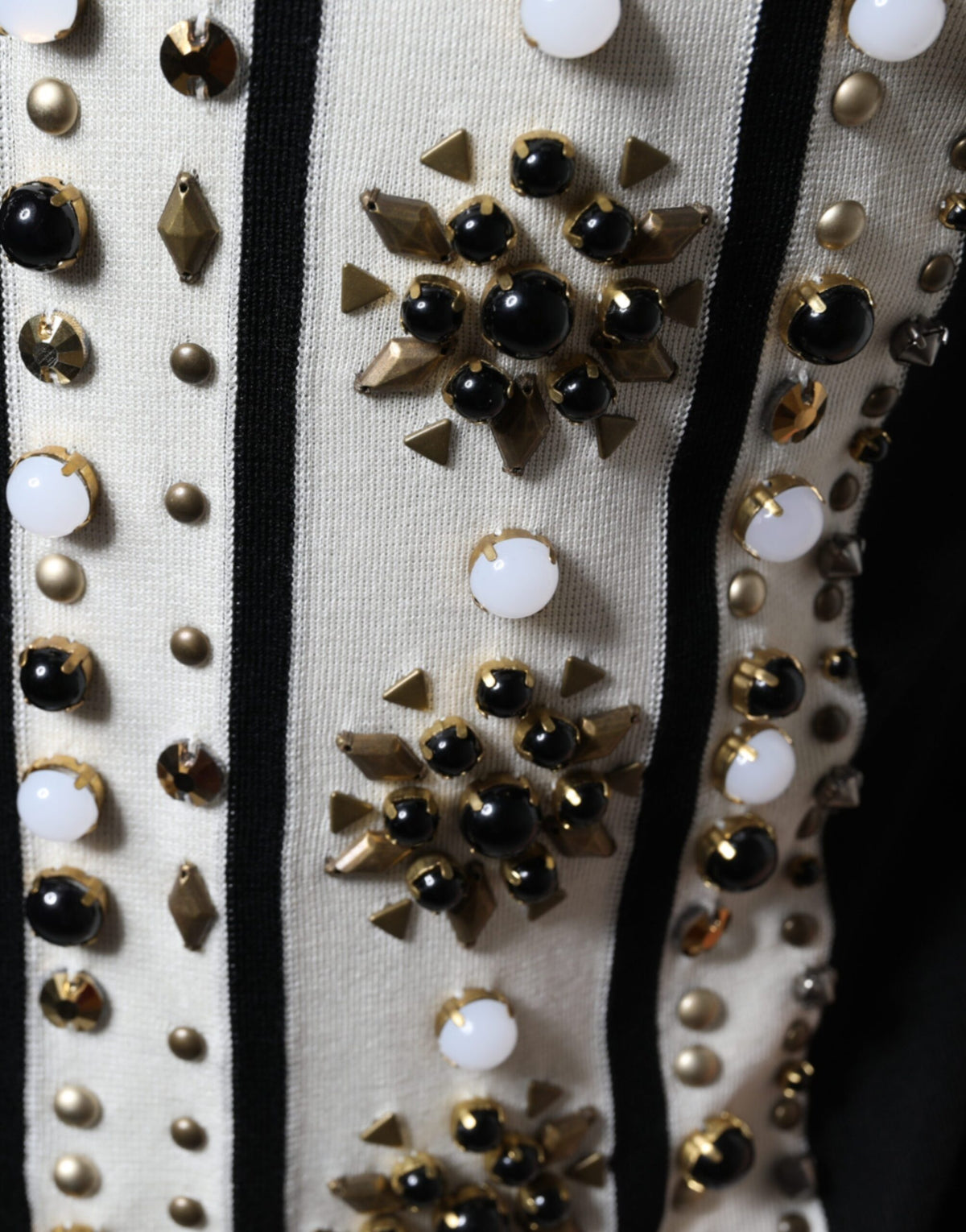 Indulge in the Dolce & Gabbana White Black Silk Studded Stone Crystal Shirt, where exquisite silk craftsmanship meets timeless elegance, perfect for the discerning individual.