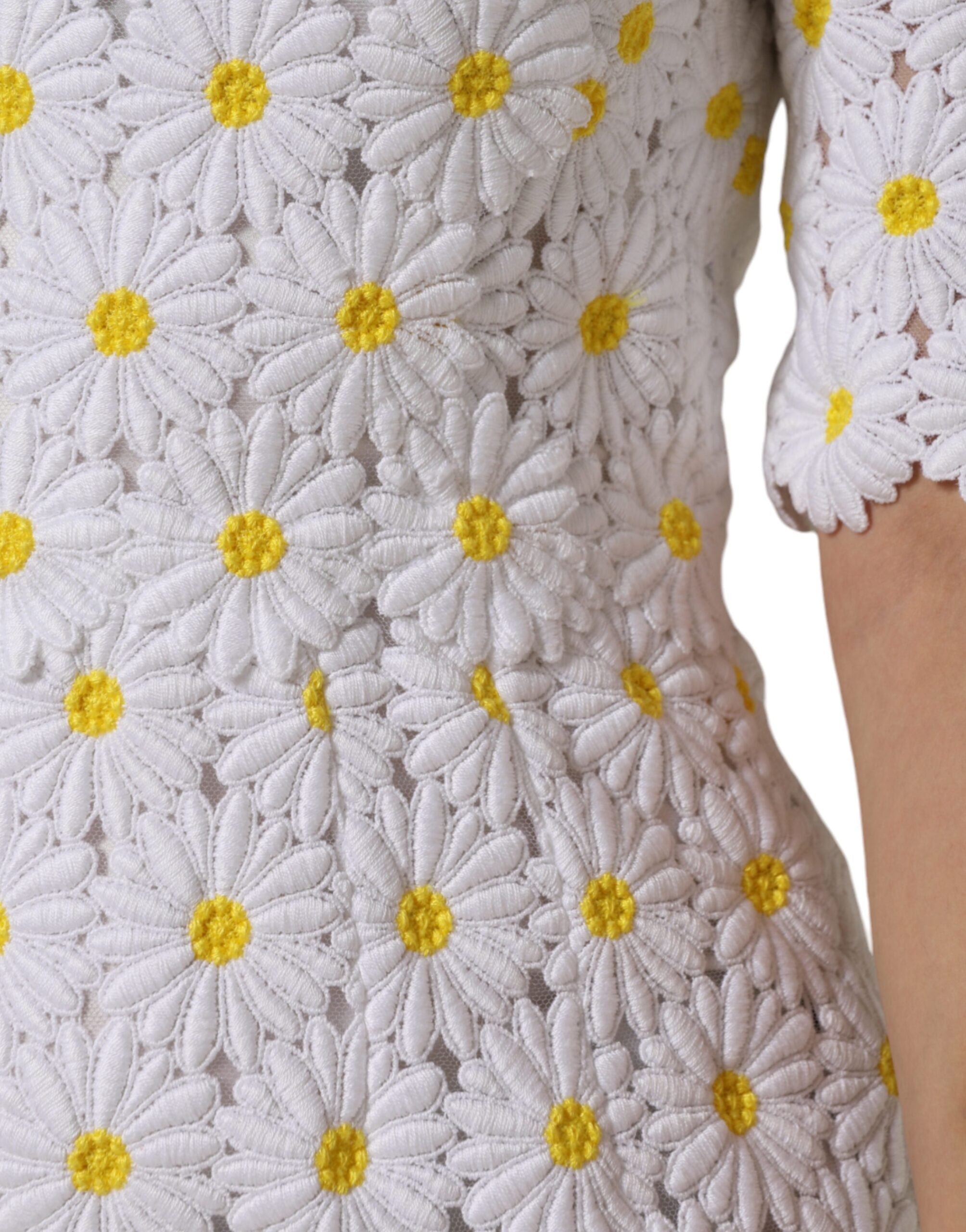 Experience the exquisite allure of the Dolce & Gabbana White Daisy Macrame Lace Sheath Midi Dress, a timeless masterpiece crafted from luxurious materials, perfect for elevated occasions.