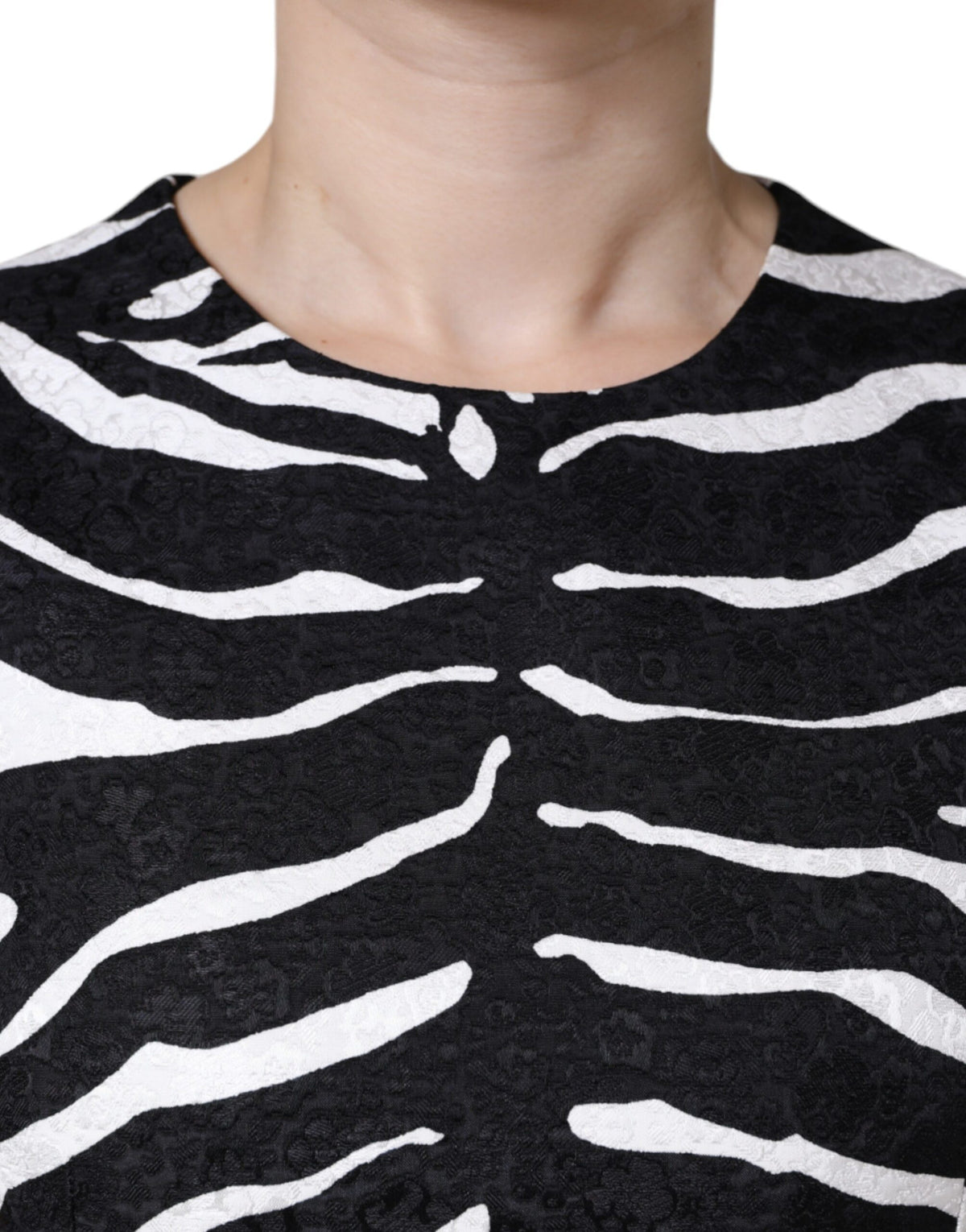 Indulge in the exquisite allure of the Dolce & Gabbana Black White Zebra A-line Sheath Mini Dress, a masterpiece of Italian craftsmanship blending luxurious viscose and cotton for timeless elegance.