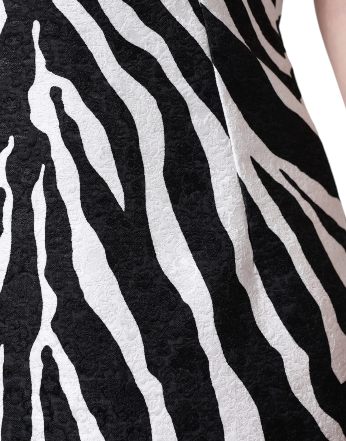 Elevate your wardrobe with the Dolce & Gabbana Black White Zebra A-line Sheath Mini Dress, a masterpiece of Italian craftsmanship in luxurious viscose and cotton, embodying timeless elegance.