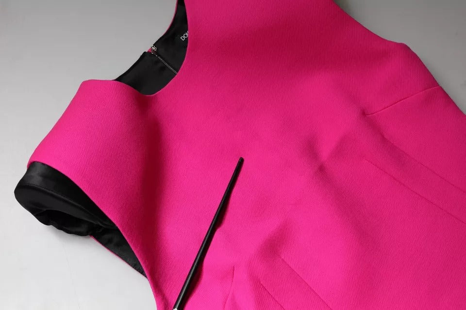 Experience the allure of the Dolce & Gabbana Pink Sleeveless Bodycon A-line Mini Dress, crafted from luxurious Virgin Wool and silk blend, embodying timeless elegance and sophistication.