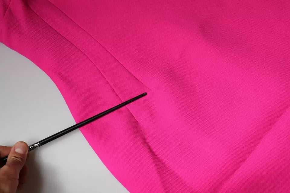Experience the allure of the Dolce & Gabbana Pink Sleeveless Bodycon A-line Mini Dress, crafted from luxurious virgin wool, embodying exquisite Italian craftsmanship and timeless elegance.