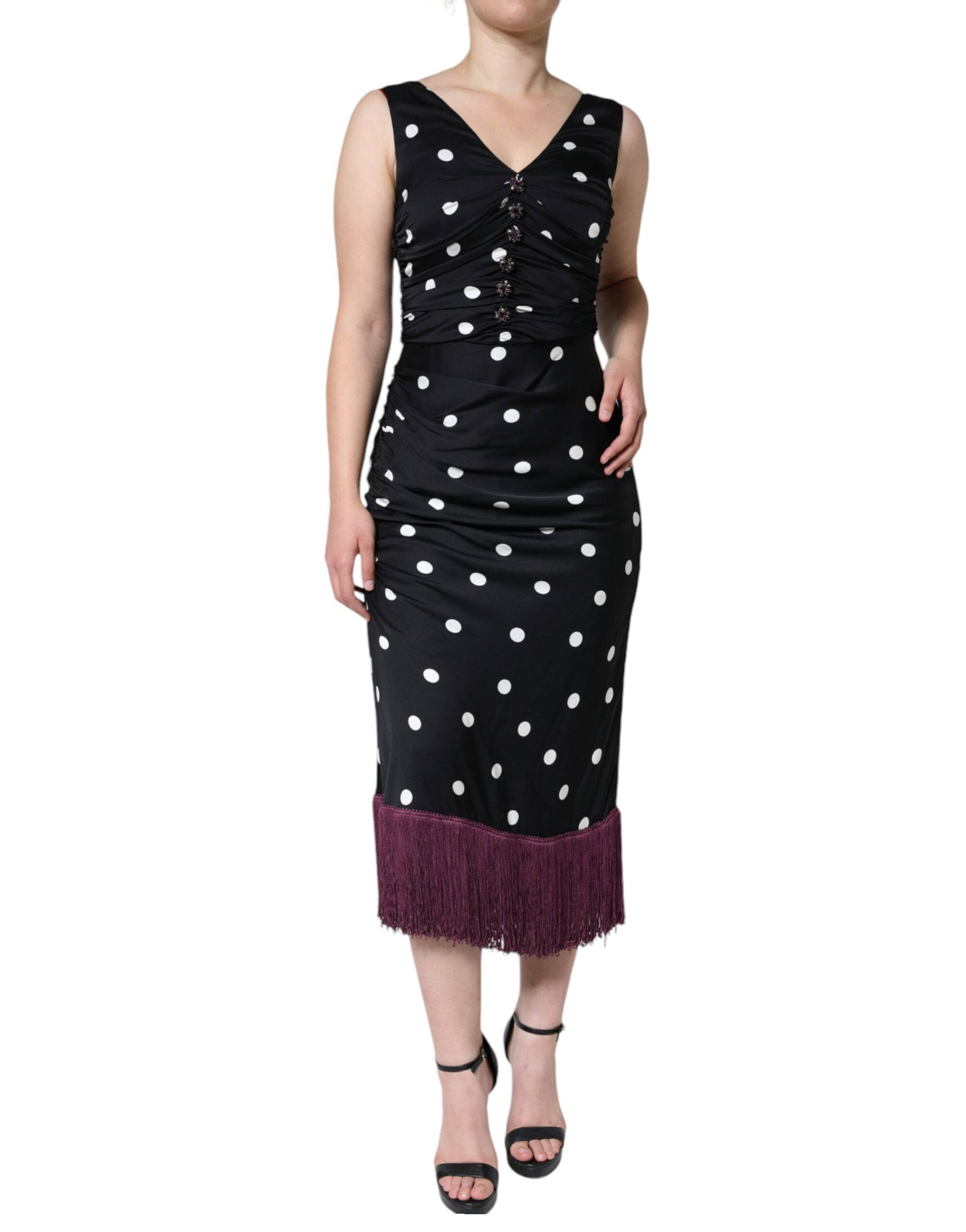 Indulge in the Dolce & Gabbana Black Silk Polka Dot Vneck Tassel Midi Dress, a timeless masterpiece of exquisite silk and unparalleled craftsmanship, perfect for the discerning fashionista.