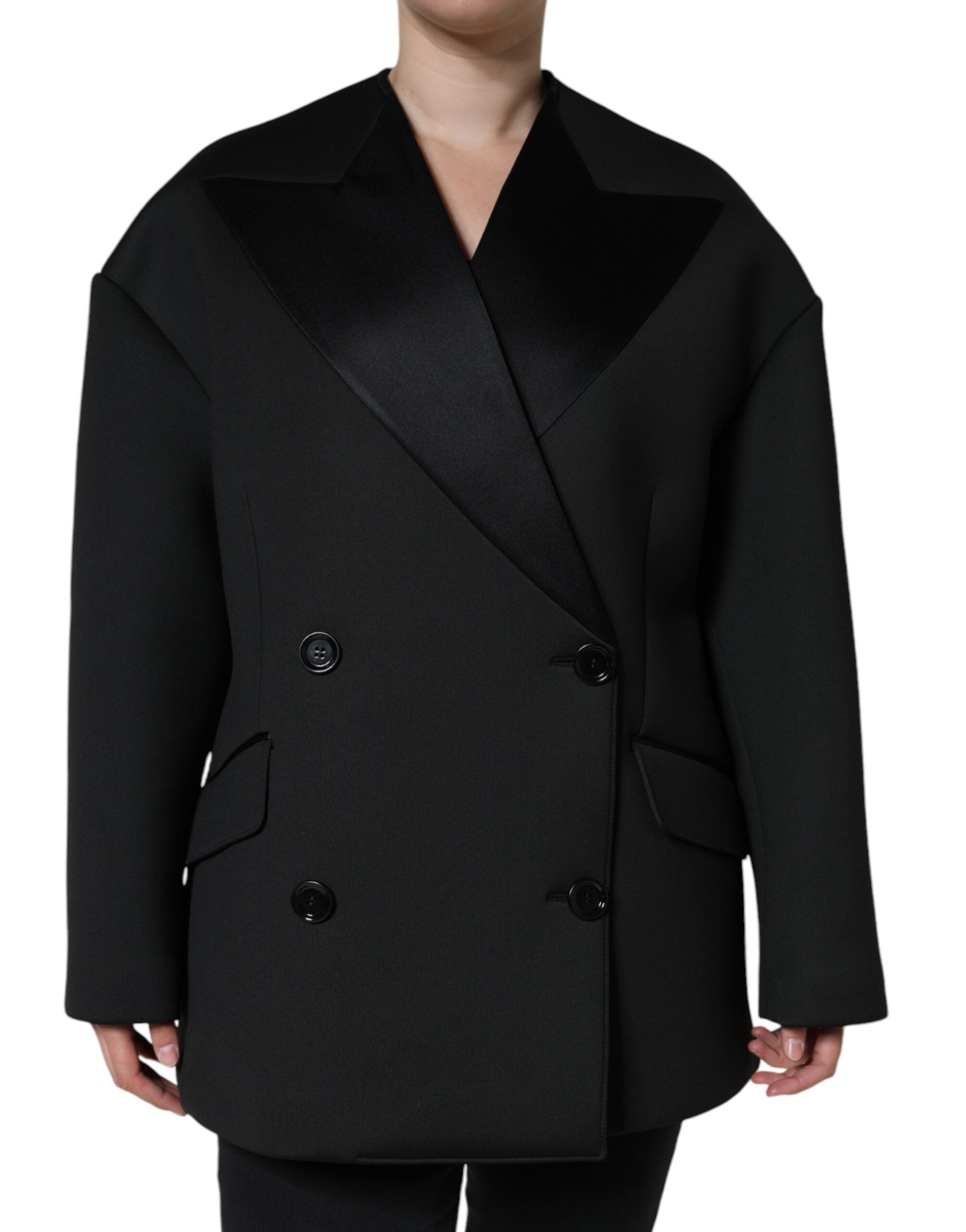 Elevate your wardrobe with the Dolce & Gabbana Black Polyester Double Breasted Coat Jacket, a masterpiece of Italian craftsmanship blending luxurious materials for timeless sophistication.