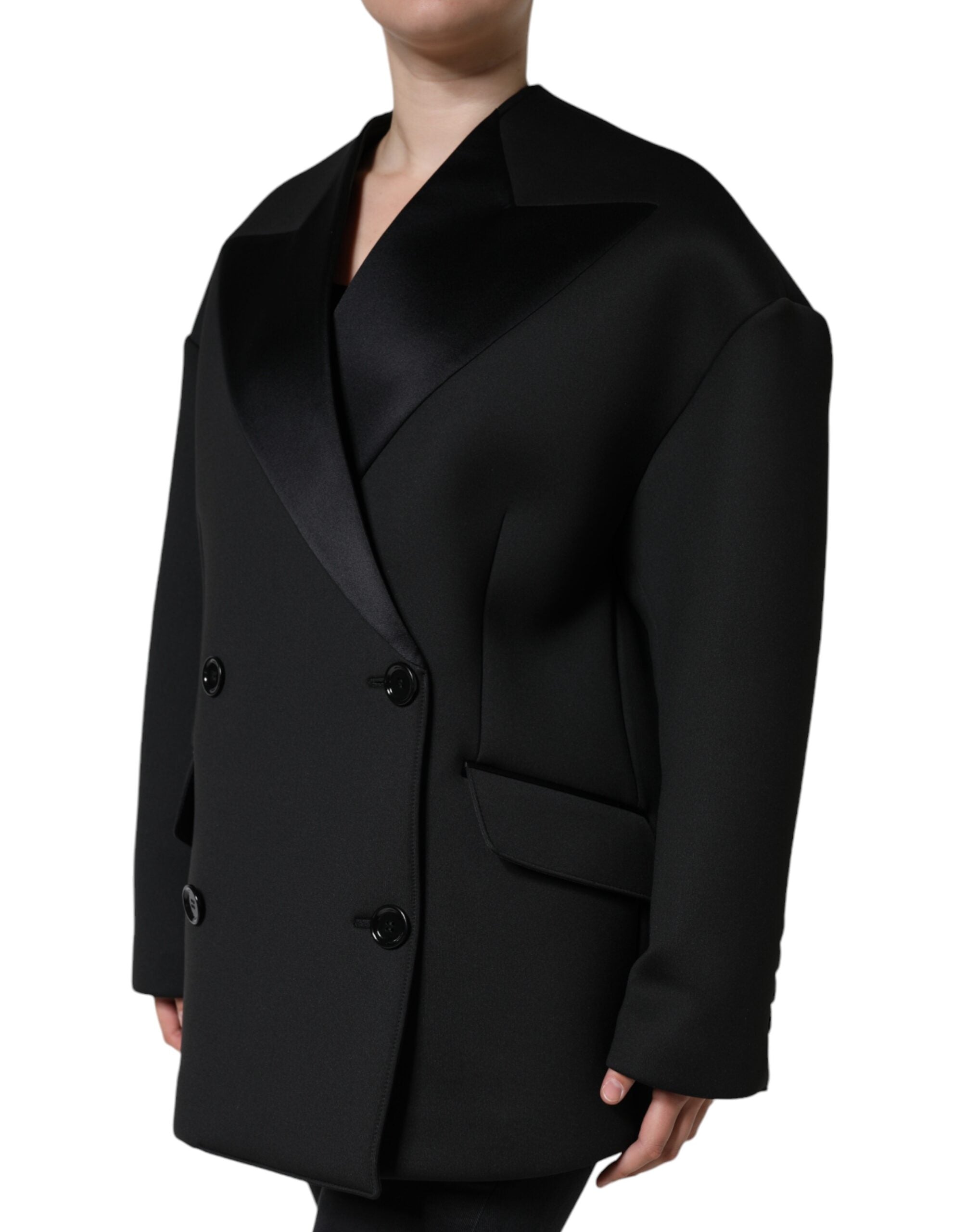Discover the Dolce & Gabbana Black Polyester Double Breasted Coat Jacket, a masterpiece of exquisite craftsmanship and luxurious materials, perfect for the discerning individual.