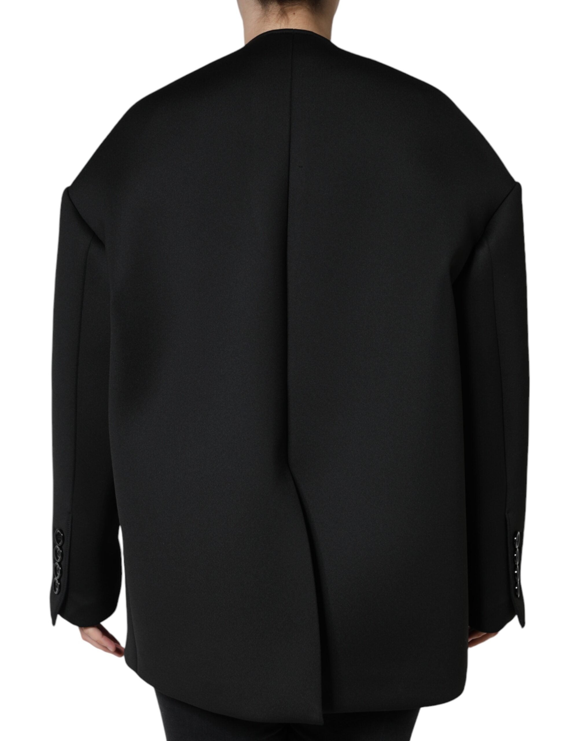 Discover the Dolce & Gabbana Black Polyester Double Breasted Coat Jacket, a timeless embodiment of elegance crafted from luxurious materials, perfect for the discerning individual.