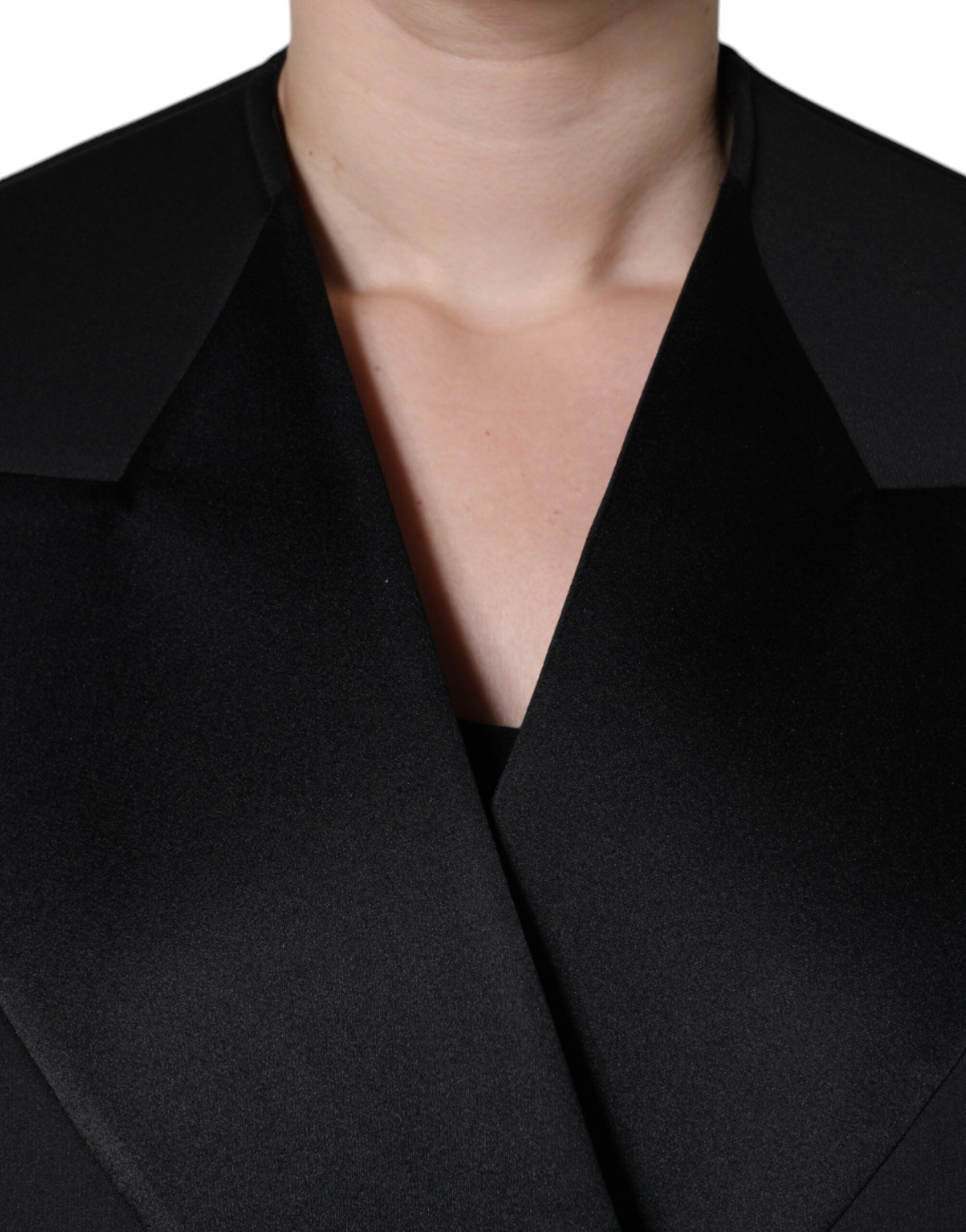 Experience the exquisite craftsmanship of the Dolce & Gabbana Black Polyester Double Breasted Coat Jacket, a timeless piece that elevates your luxury wardrobe with its sumptuous blend of materials and sophisticated design.