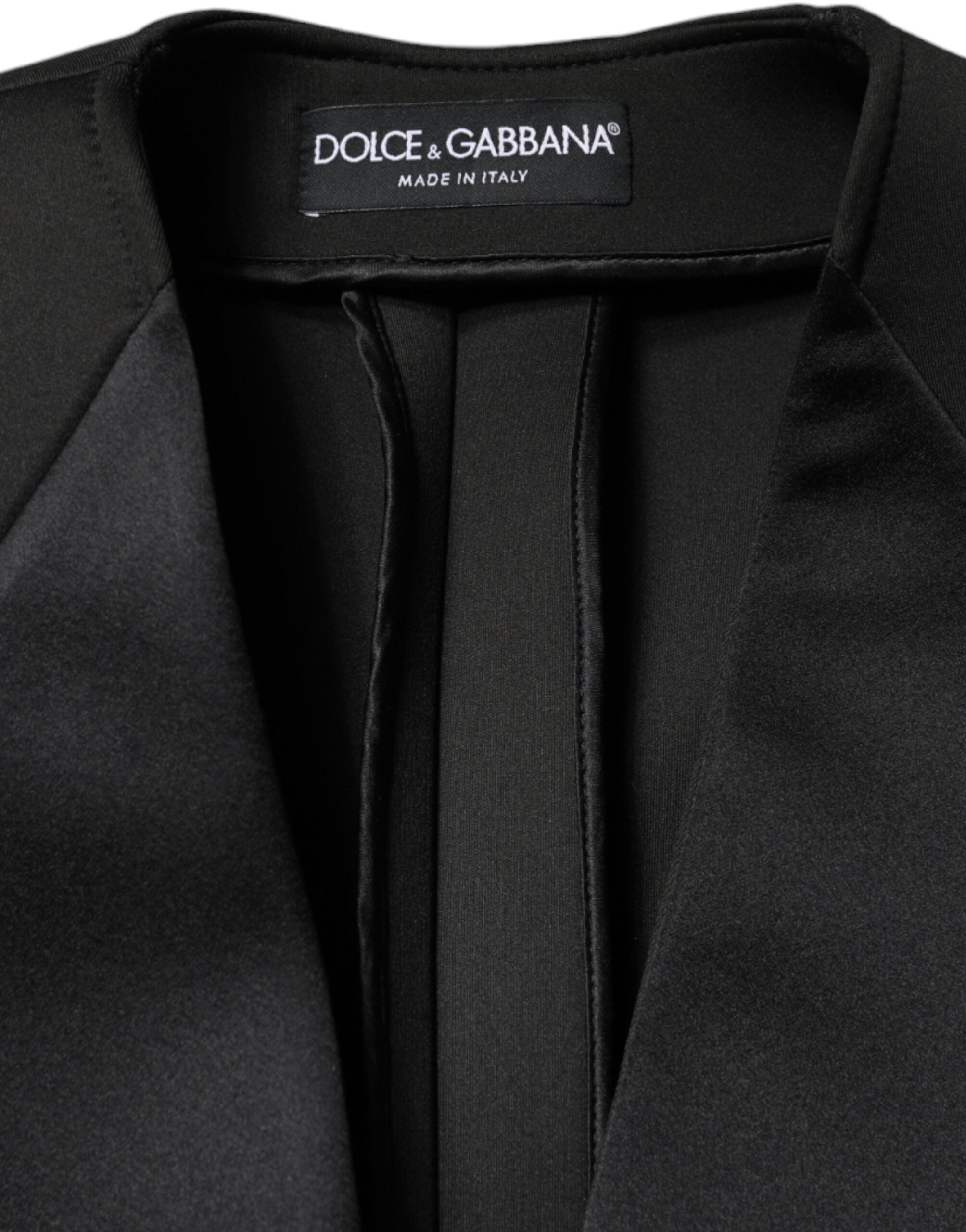 Elevate your wardrobe with the Dolce & Gabbana Black Polyester Double Breasted Coat Jacket, a masterpiece of Italian craftsmanship that embodies timeless elegance and luxurious allure.