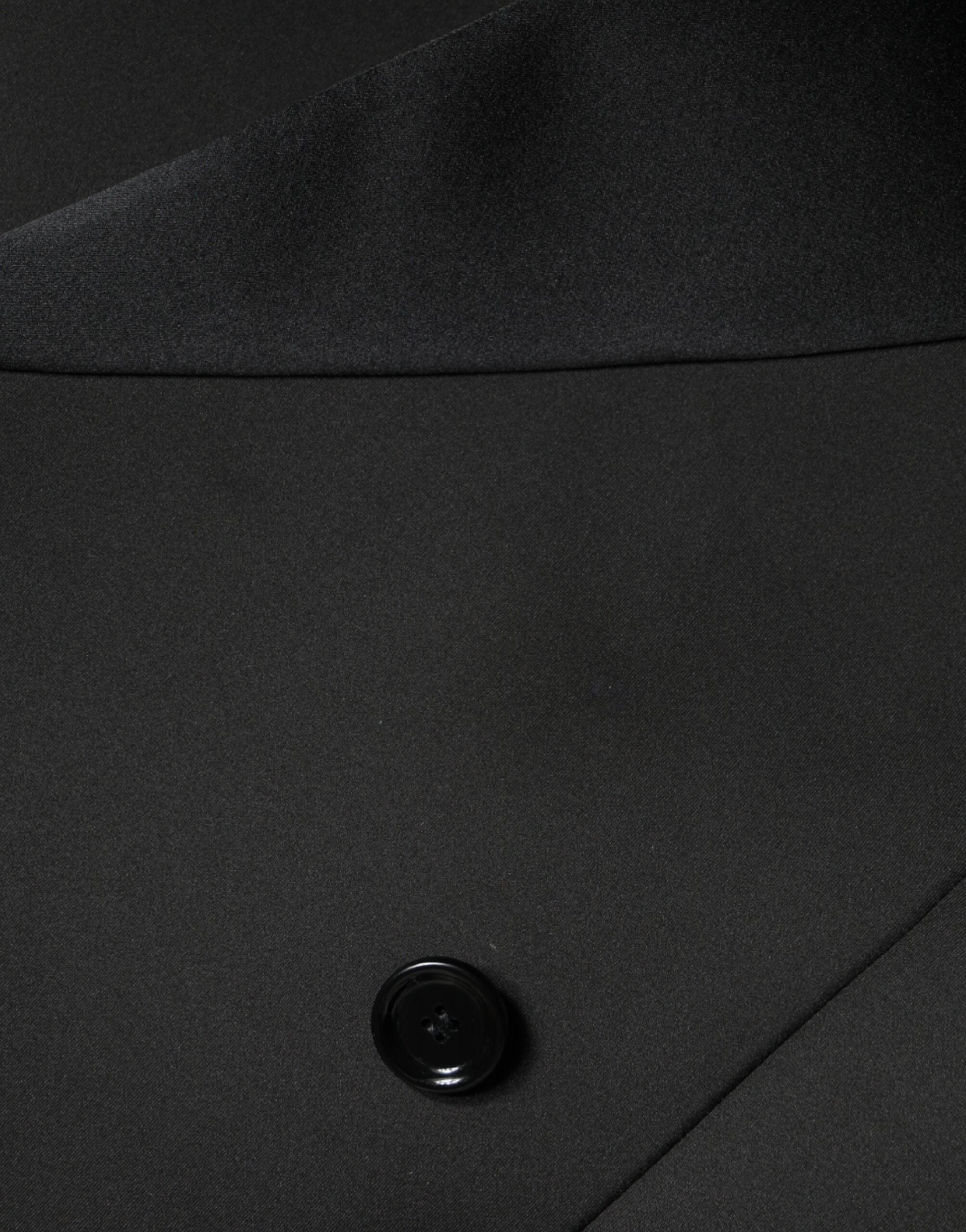 Discover the Dolce & Gabbana Black Polyester Double Breasted Coat Jacket, a masterpiece of exquisite craftsmanship and luxurious materials, perfect for the discerning individual.