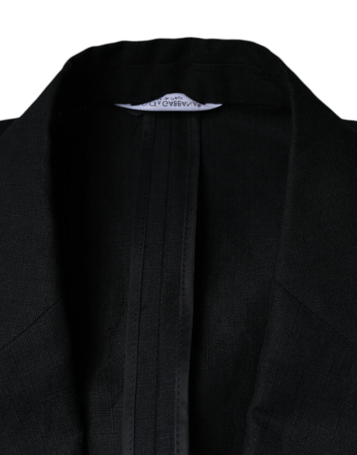 Elevate your wardrobe with the Dolce & Gabbana Black Linen Double Breasted Dress Blazer, a masterpiece of Italian craftsmanship that embodies timeless sophistication and luxury.