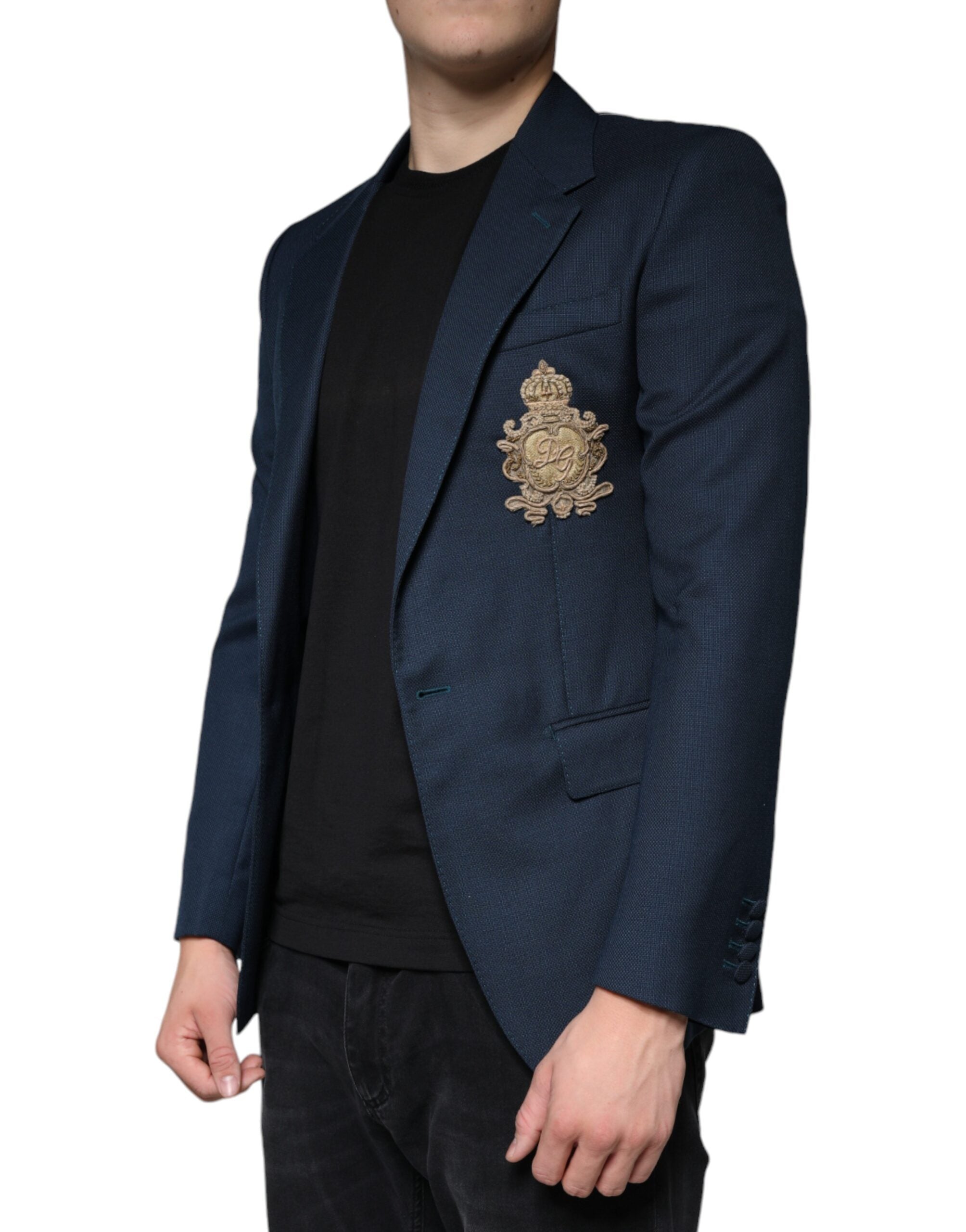 Discover the Dolce & Gabbana Blue Wool Logo Blazer, a masterpiece of Italian craftsmanship in luxurious virgin wool and silk, perfect for the discerning individual.