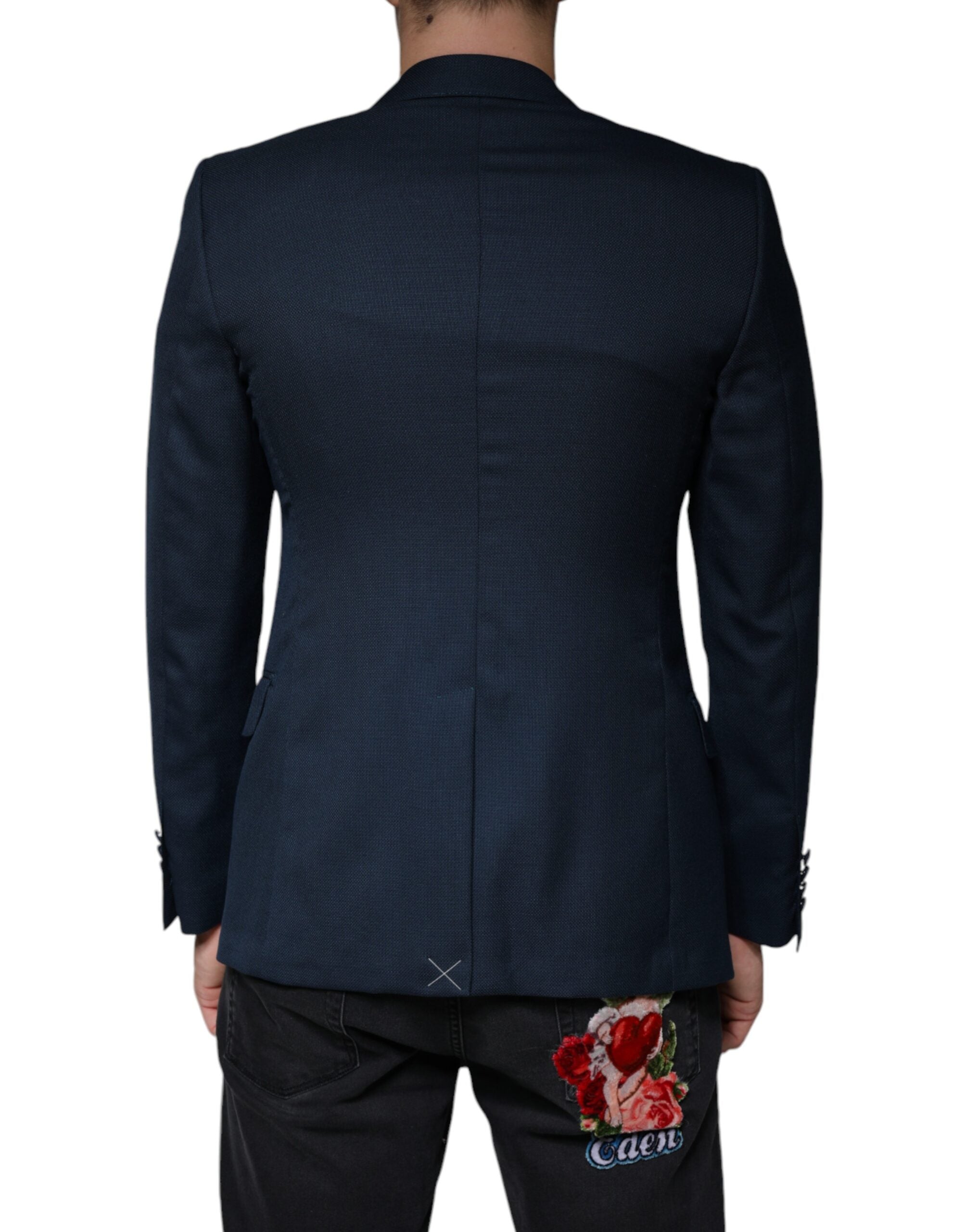 Discover the Dolce & Gabbana Blue Wool Logo Single Breasted Coat Blazer, a masterpiece of Italian craftsmanship in luxurious virgin wool and silk, perfect for timeless elegance.