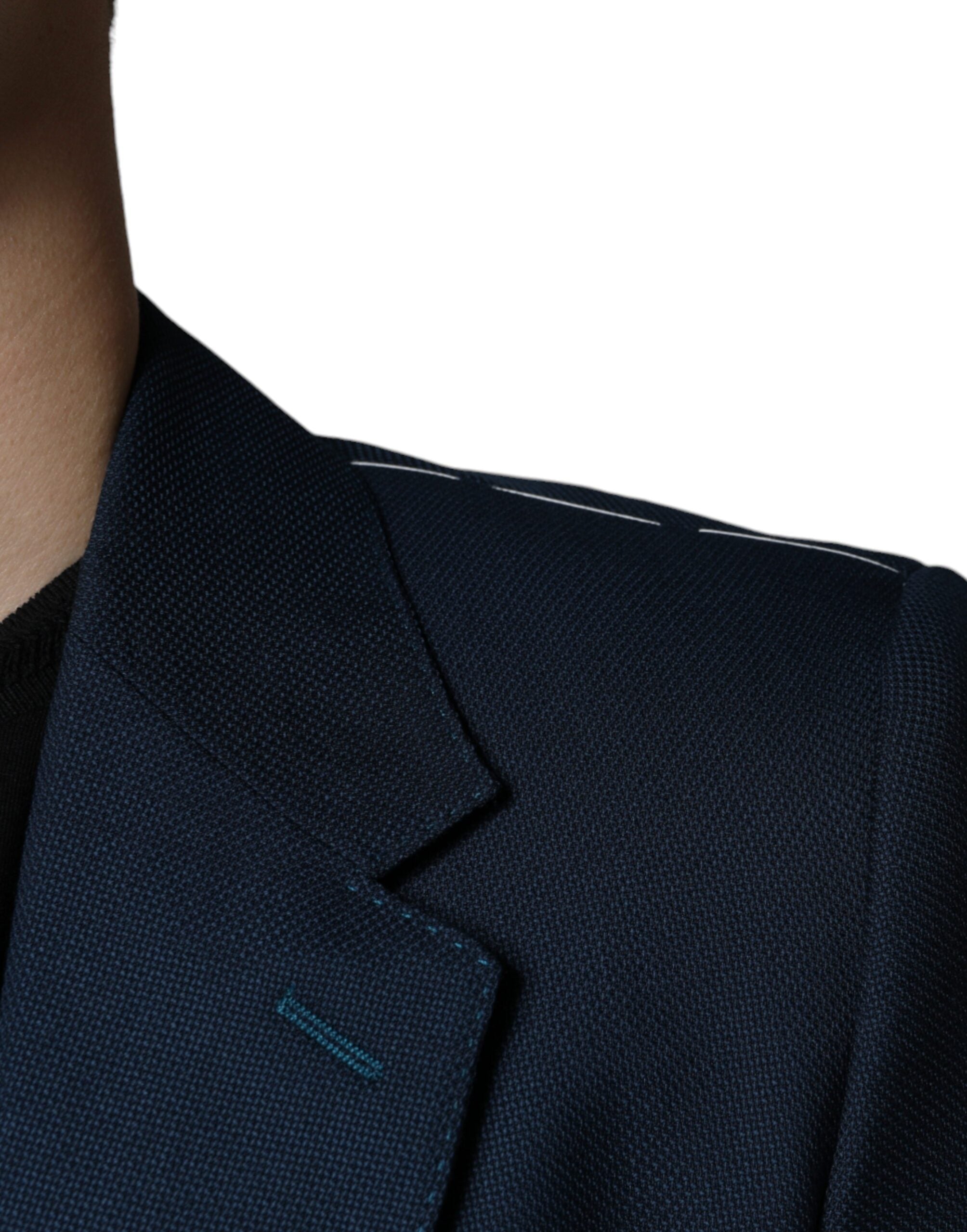 Indulge in the exquisite Dolce & Gabbana Blue Wool Logo Blazer, a masterpiece of Italian craftsmanship in luxurious virgin wool and silk, perfect for timeless elegance.