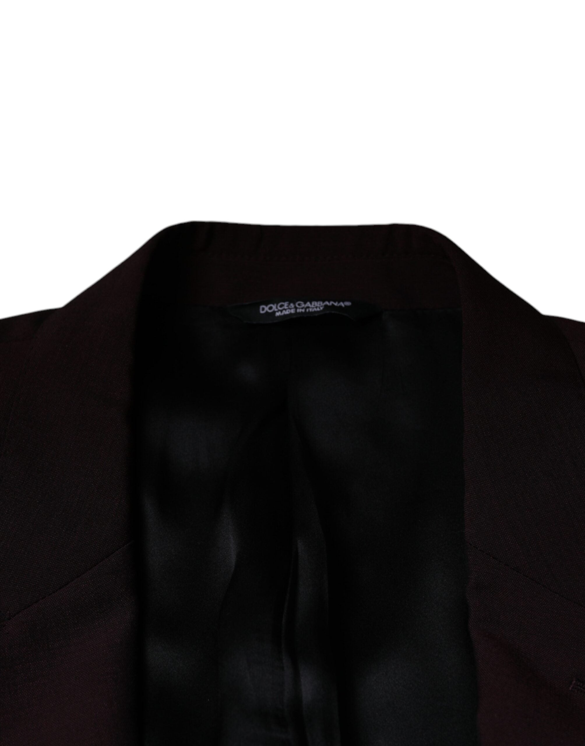 Discover the Dolce & Gabbana Bordeaux Wool Single Breasted Dress Blazer, a masterpiece of Italian craftsmanship that embodies timeless elegance and sophisticated allure.