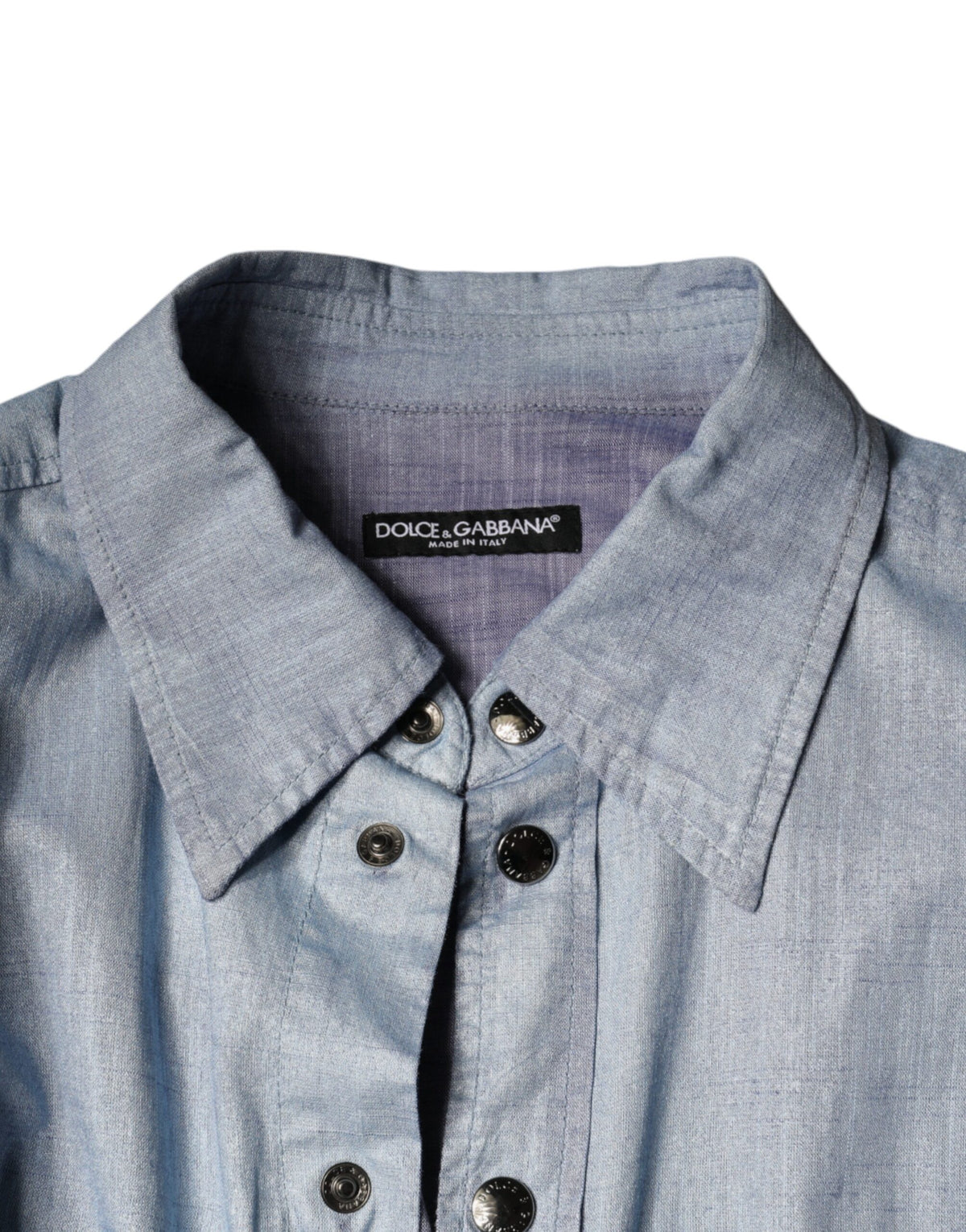 Indulge in the exquisite Dolce & Gabbana Light Blue Cotton Button Down, a masterpiece of Italian craftsmanship that embodies timeless elegance and effortless sophistication.