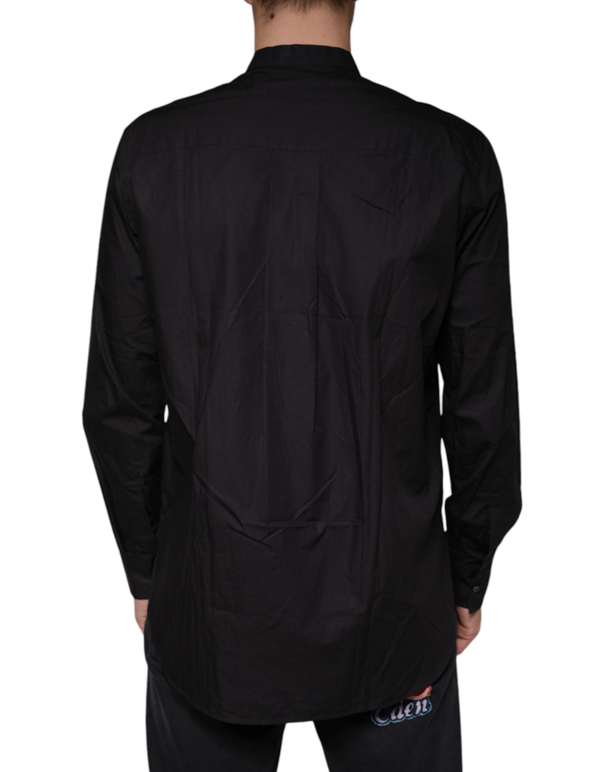 Indulge in the exquisite Dolce & Gabbana Black Cotton Button Down Shirt, a masterpiece of Italian craftsmanship designed for those who embody elegance and sophistication.