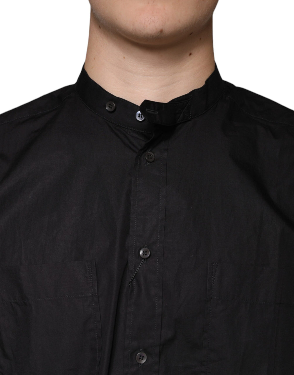 Indulge in the exquisite Dolce & Gabbana Black Cotton Button Down Shirt, a masterpiece of Italian craftsmanship that embodies timeless elegance and sophisticated allure.