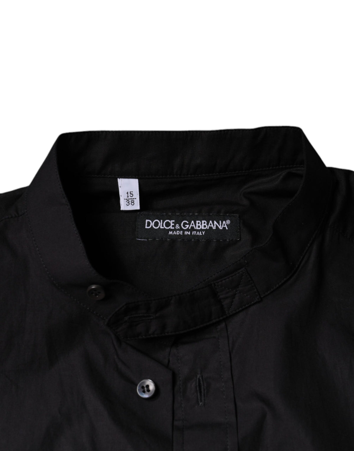 Discover the Dolce & Gabbana Black Cotton Button Down Shirt, a masterpiece of Italian craftsmanship, blending elegance and comfort for the discerning individual.