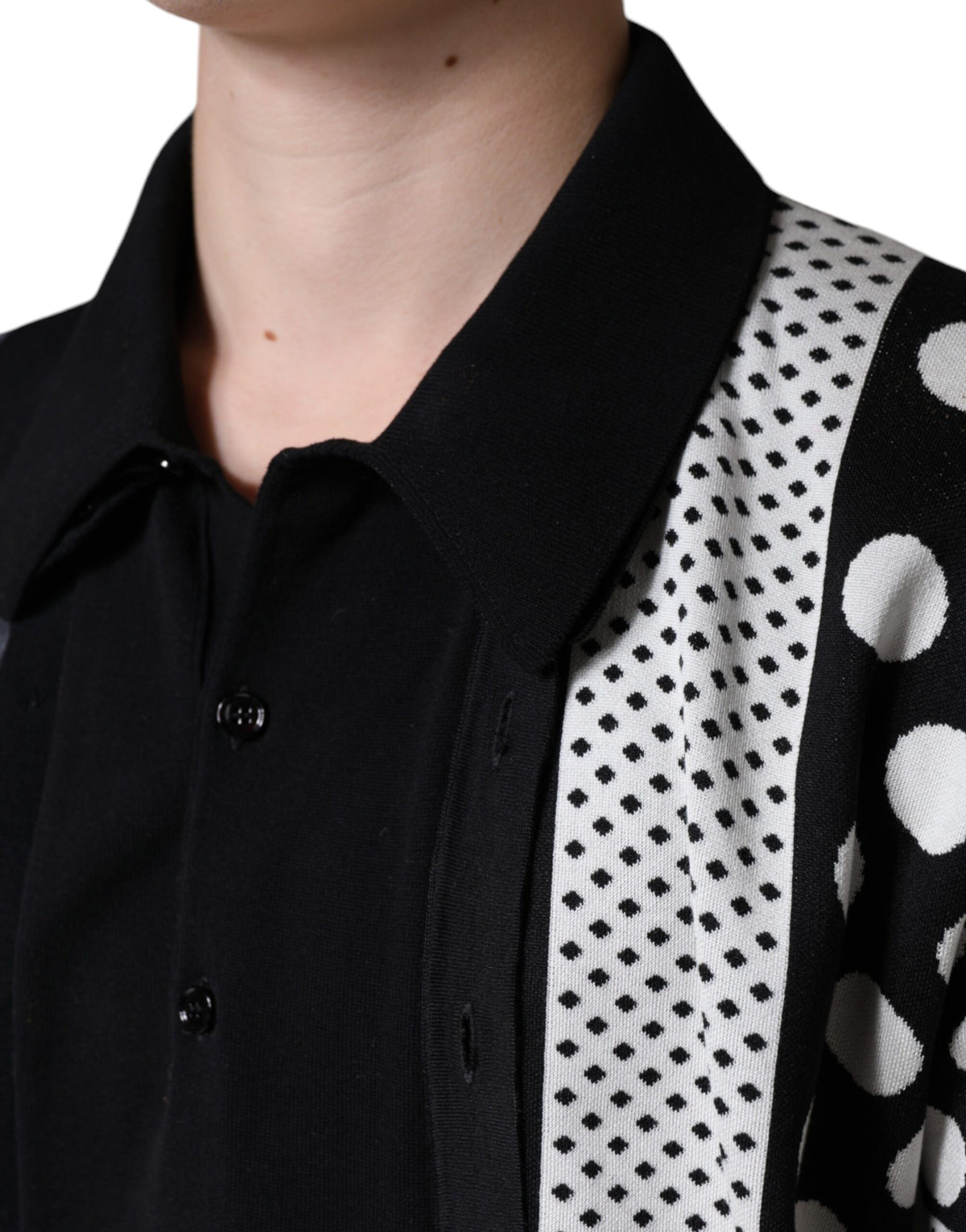 Experience the allure of Dolce & Gabbana's Black White Polka Dot Collared Polo T-shirt, a luxurious blend of silk, cotton, and virgin wool that epitomizes timeless elegance and sophisticated style.