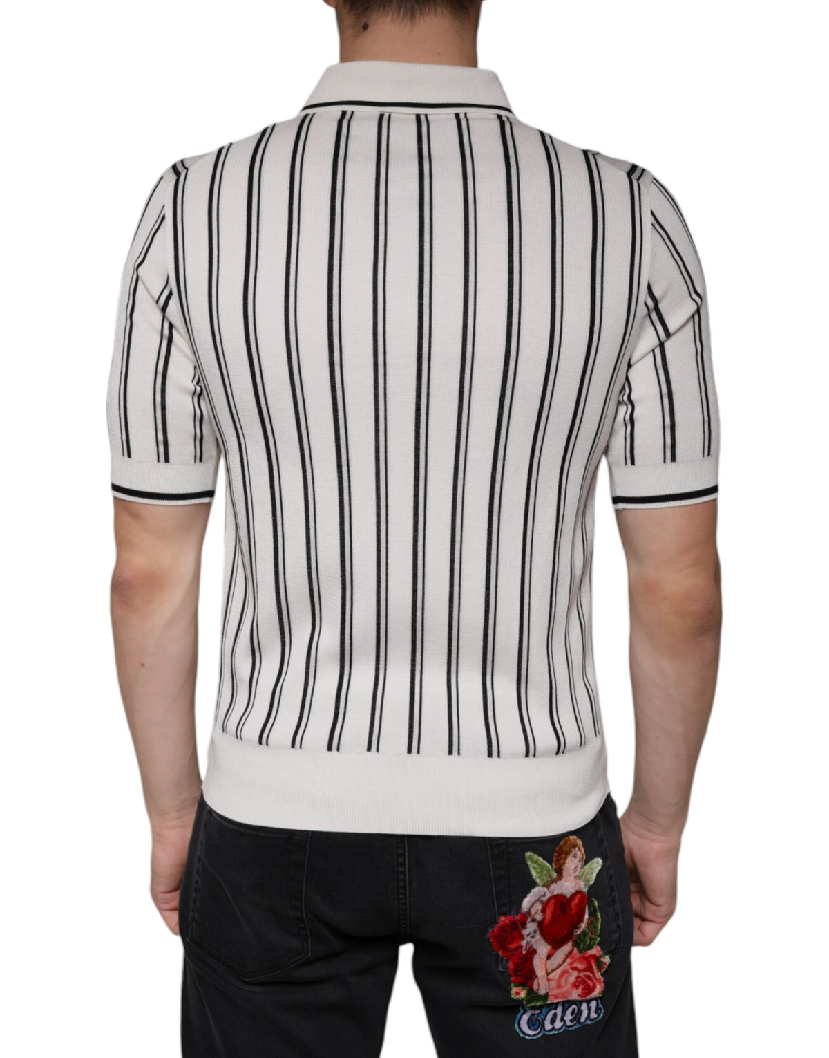 Elevate your wardrobe with the Dolce & Gabbana White Black Stripe Polo, a silk masterpiece that embodies luxury and sophistication for the discerning individual.
