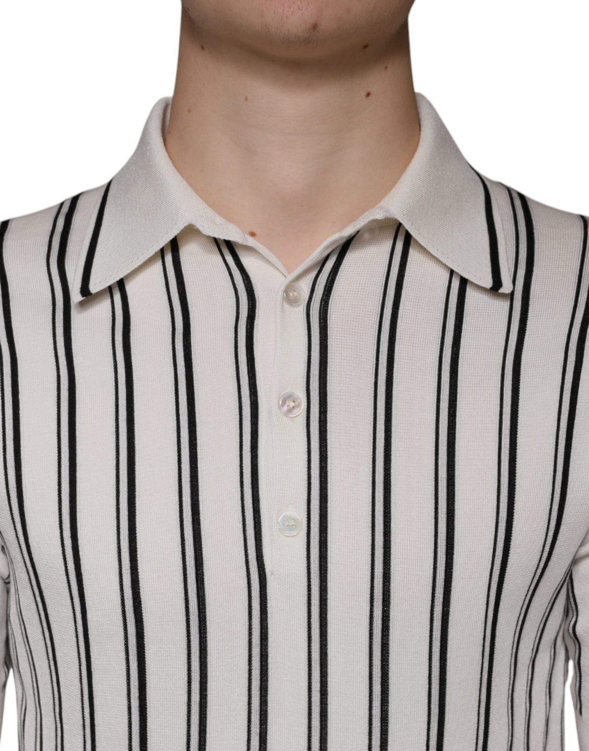 Indulge in the exquisite Dolce & Gabbana White Black Stripe Polo, crafted from luxurious silk, embodying elegance and sophistication for the discerning individual.
