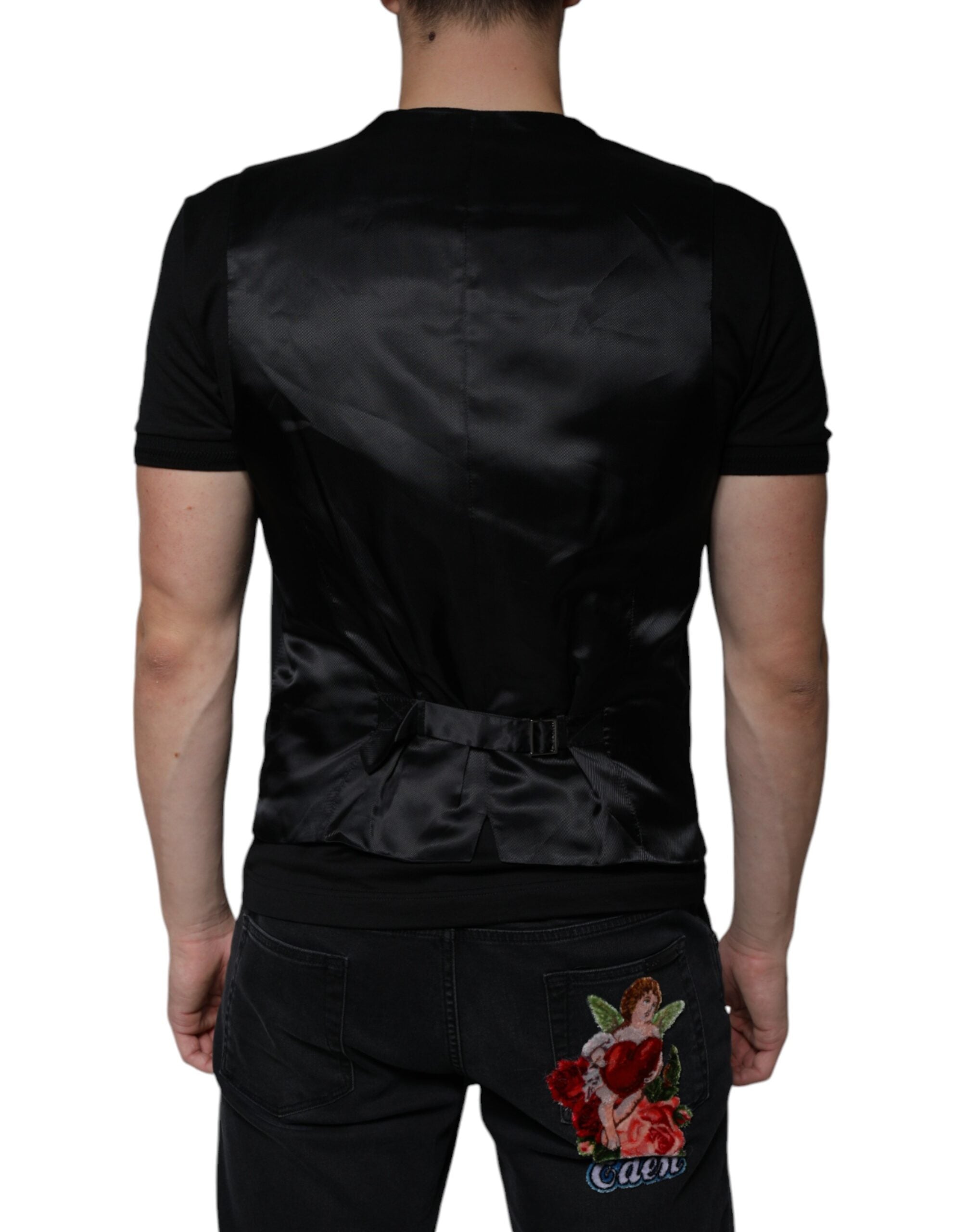 Experience the exquisite allure of the Dolce & Gabbana Black Wool Formal Dress Waistcoat Vest, crafted from luxurious materials for a sophisticated statement in any setting.