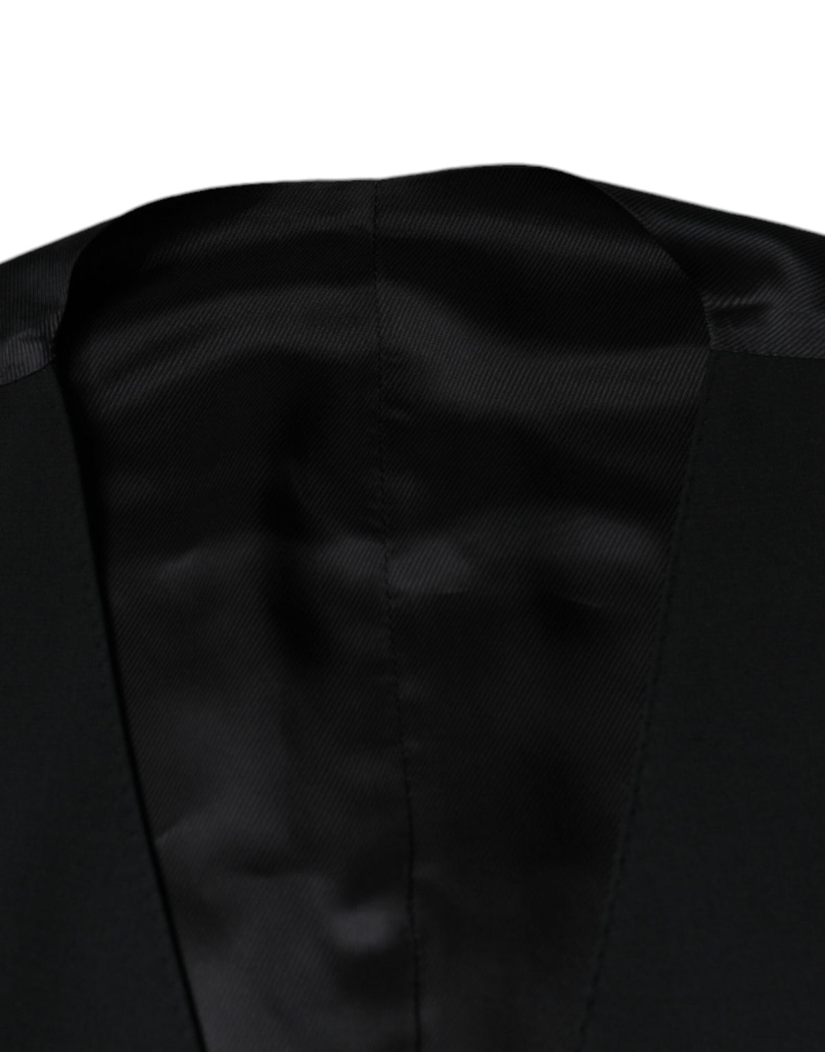 Discover the allure of the Dolce & Gabbana Black Wool Formal Dress Waistcoat Vest, a masterpiece of exquisite craftsmanship and luxurious materials, perfect for any discerning wardrobe.