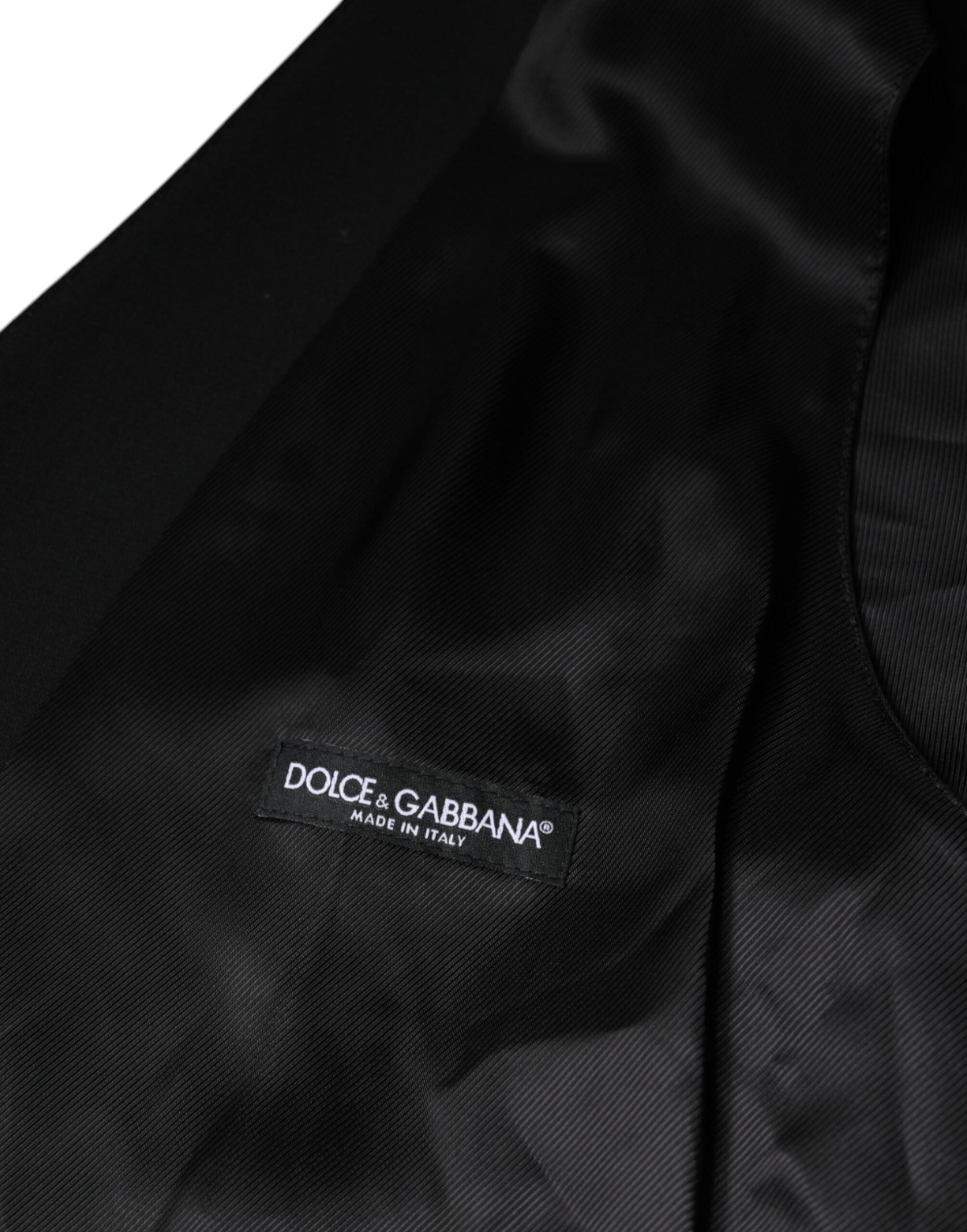 Elevate your wardrobe with the Dolce & Gabbana Black Wool Formal Dress Waistcoat Vest, a masterpiece of exquisite craftsmanship and luxurious materials, perfect for any sophisticated occasion.