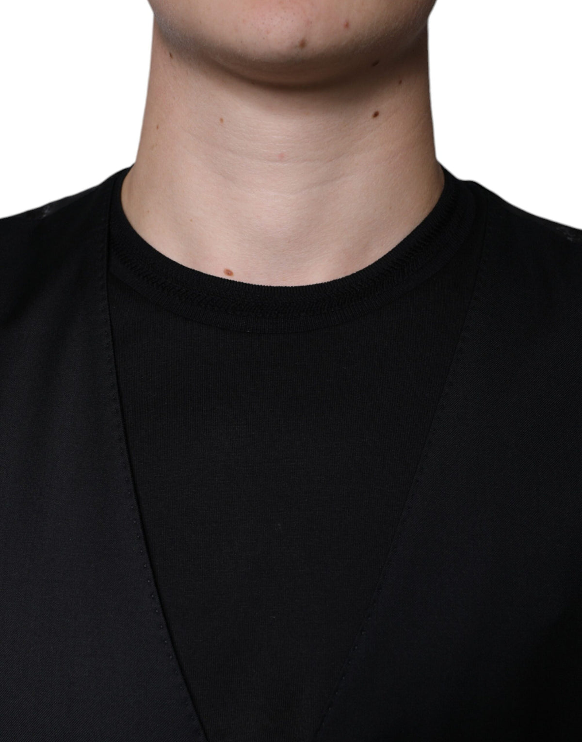 Indulge in the exquisite Dolce & Gabbana Black Wool Waistcoat Dress, a masterpiece of luxurious virgin wool that embodies sophistication and timeless elegance.