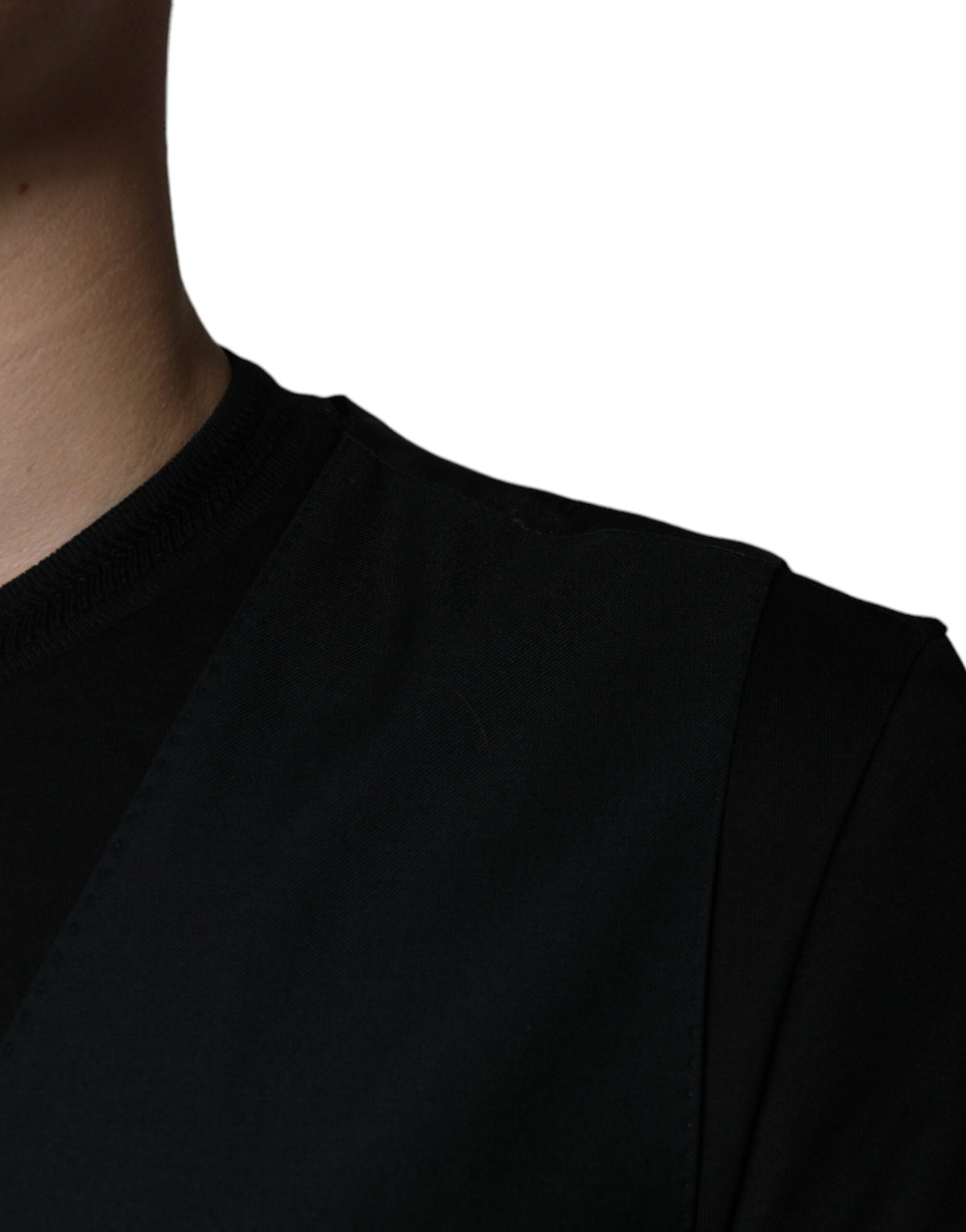 Elevate your wardrobe with the Dolce & Gabbana Black Wool Waistcoat Dress, a masterpiece of virgin wool that embodies timeless elegance and unparalleled craftsmanship.