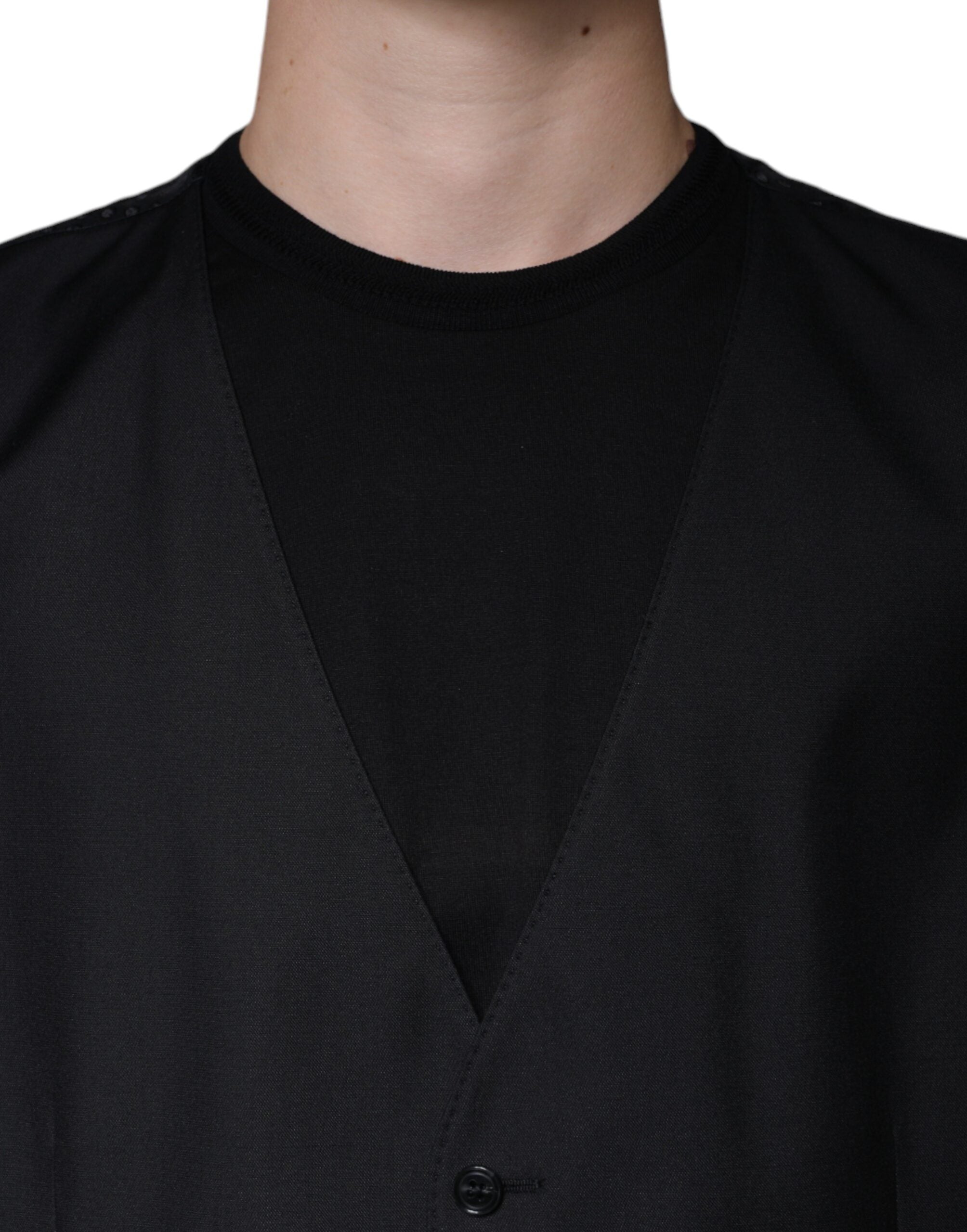 Elevate your wardrobe with the Dolce & Gabbana Black Wool Waistcoat Dress Formal Vest, a masterpiece of virgin wool and silk that embodies timeless elegance and unparalleled craftsmanship.