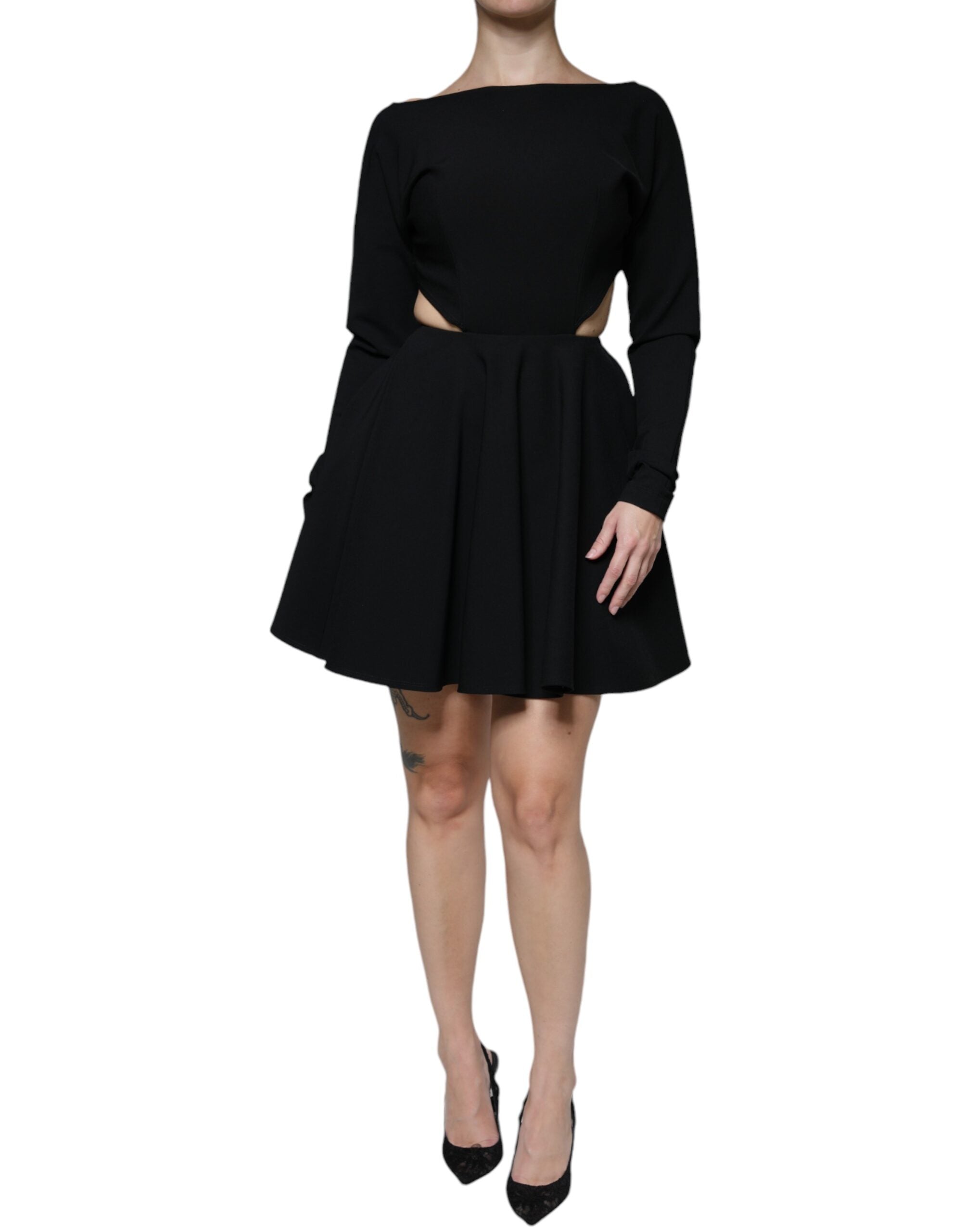 Indulge in the Dolce & Gabbana Black Viscose Cut Out A-line Long Sleeves Mini Dress, a symbol of Italian elegance crafted for the discerning individual.