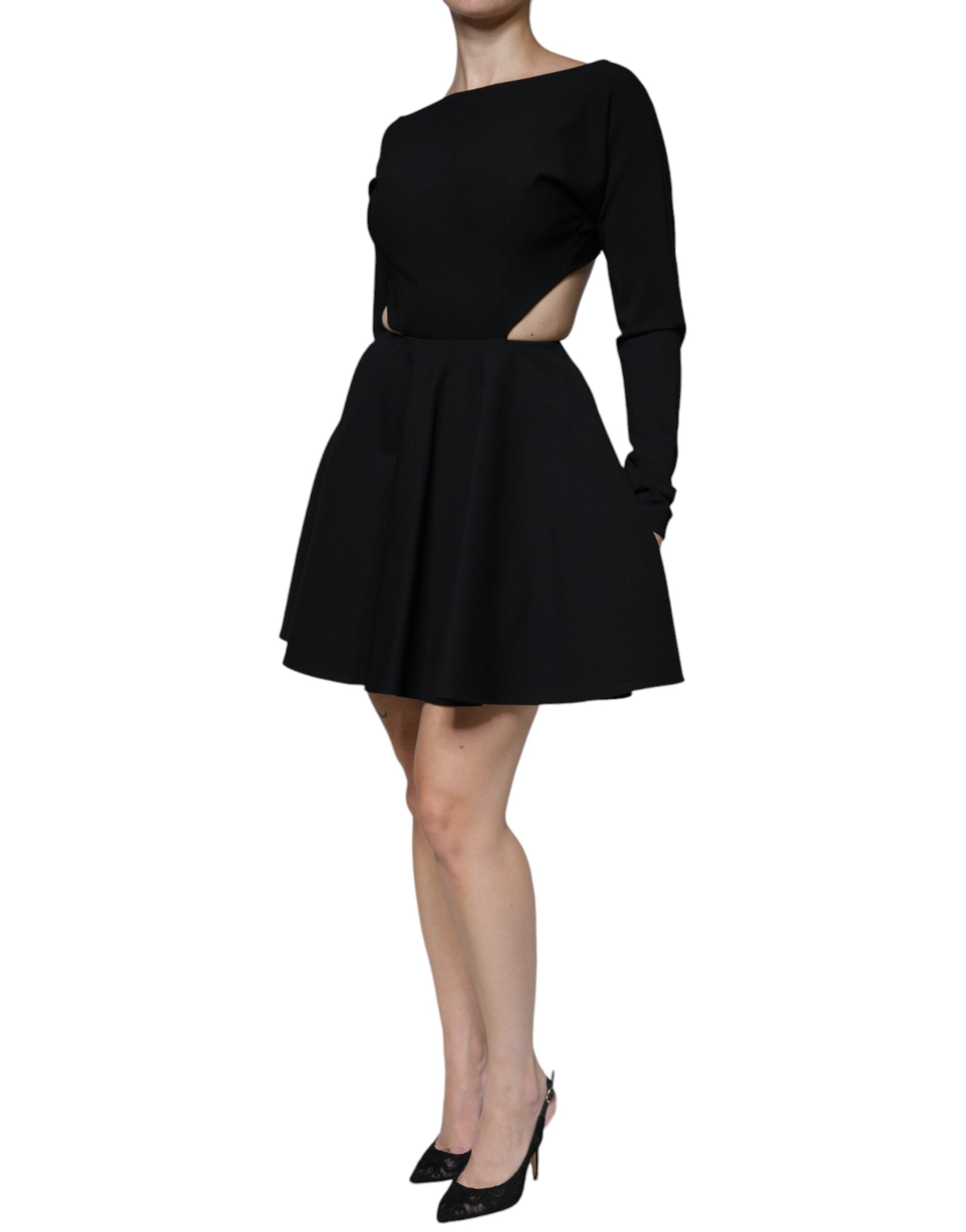 Indulge in the exquisite allure of the Dolce & Gabbana Black Viscose Cut Out A-line Long Sleeves Mini Dress, a masterpiece of Italian craftsmanship that embodies timeless elegance and sensual sophistication.