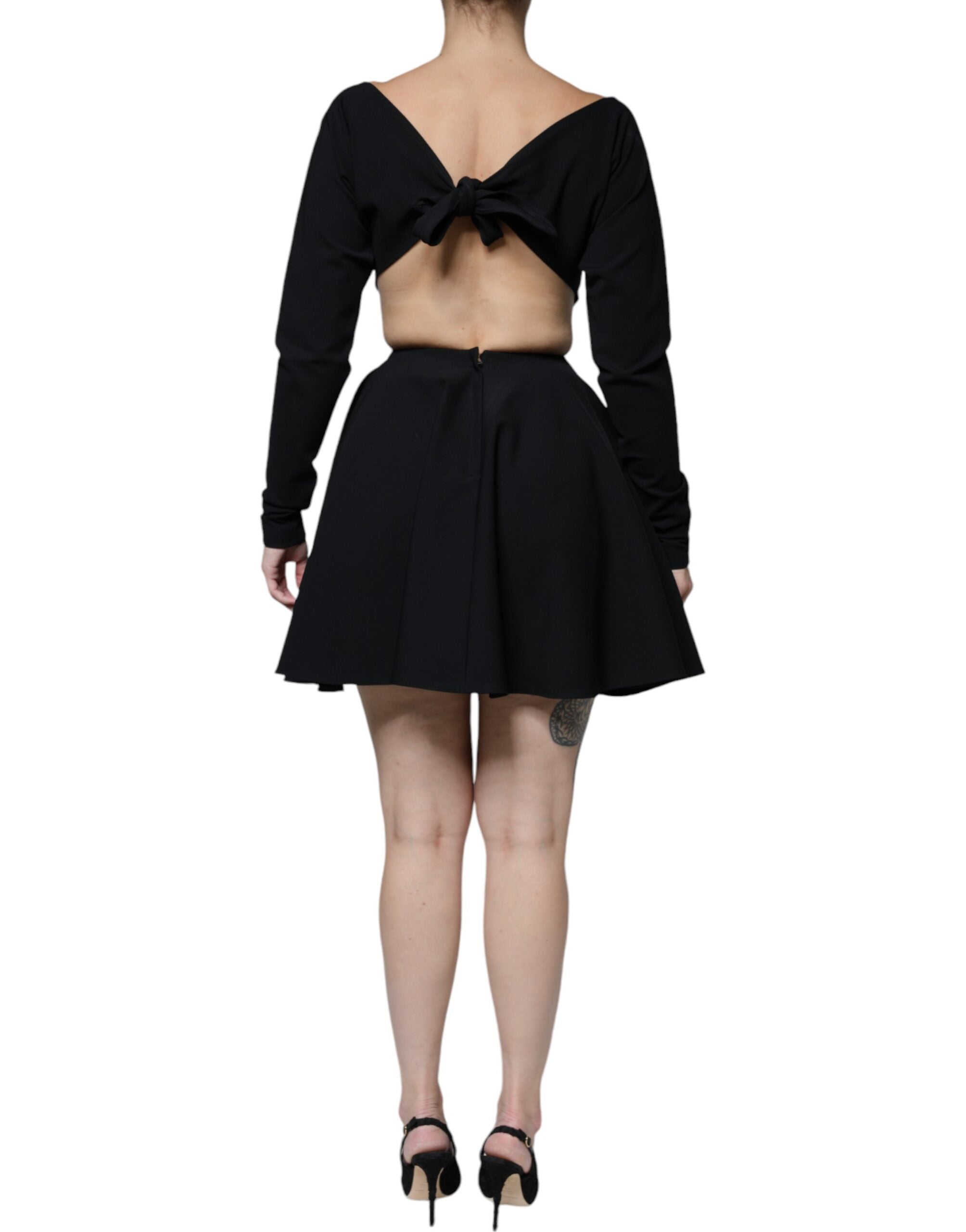 Indulge in the Dolce & Gabbana Black Viscose Cut Out A-line Long Sleeves Mini Dress, where exquisite craftsmanship meets timeless elegance, perfect for any upscale occasion.