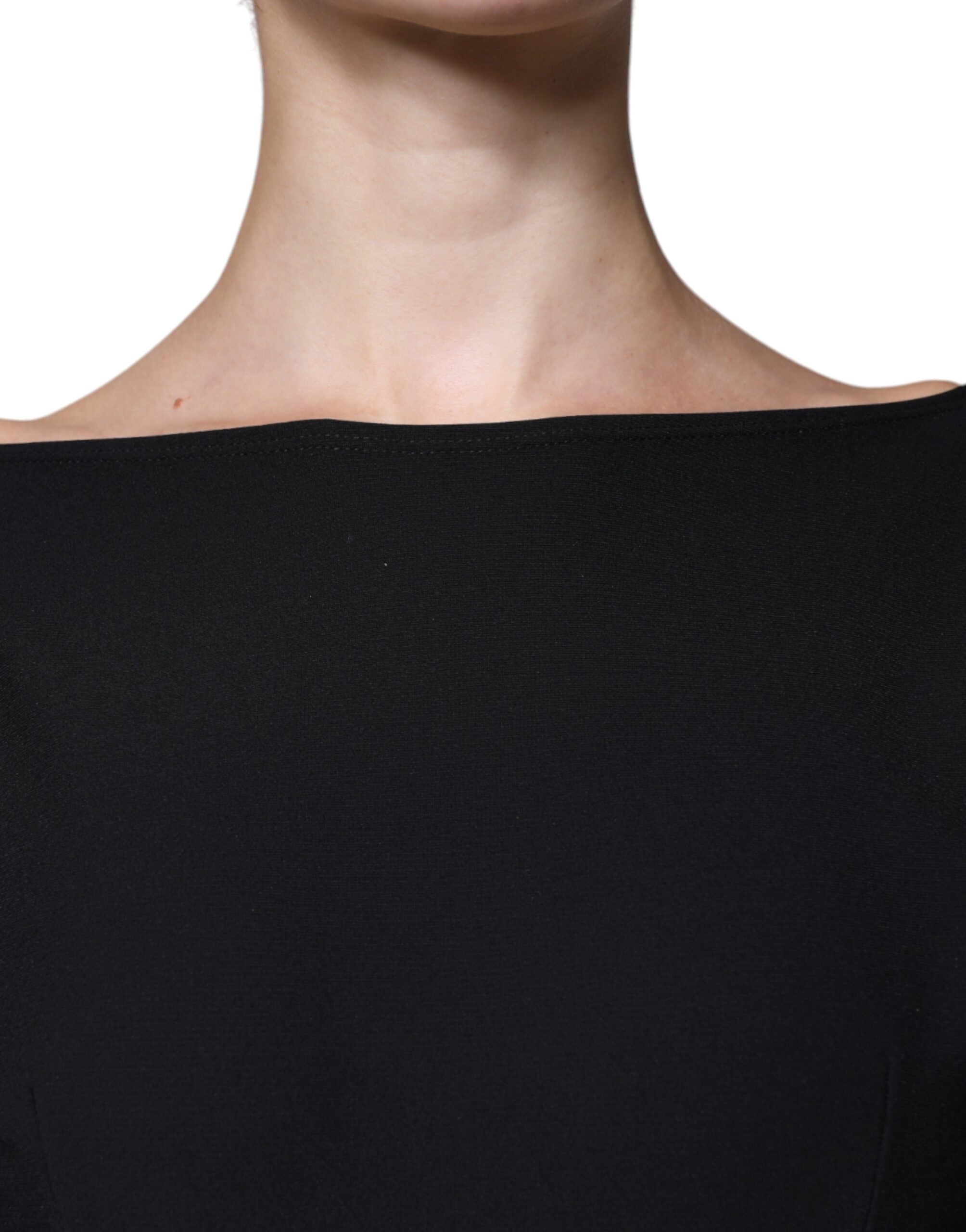 Indulge in the allure of the Dolce & Gabbana Black Viscose Cut Out A-line Long Sleeves Mini Dress, where exquisite Italian craftsmanship meets timeless elegance for the discerning individual.