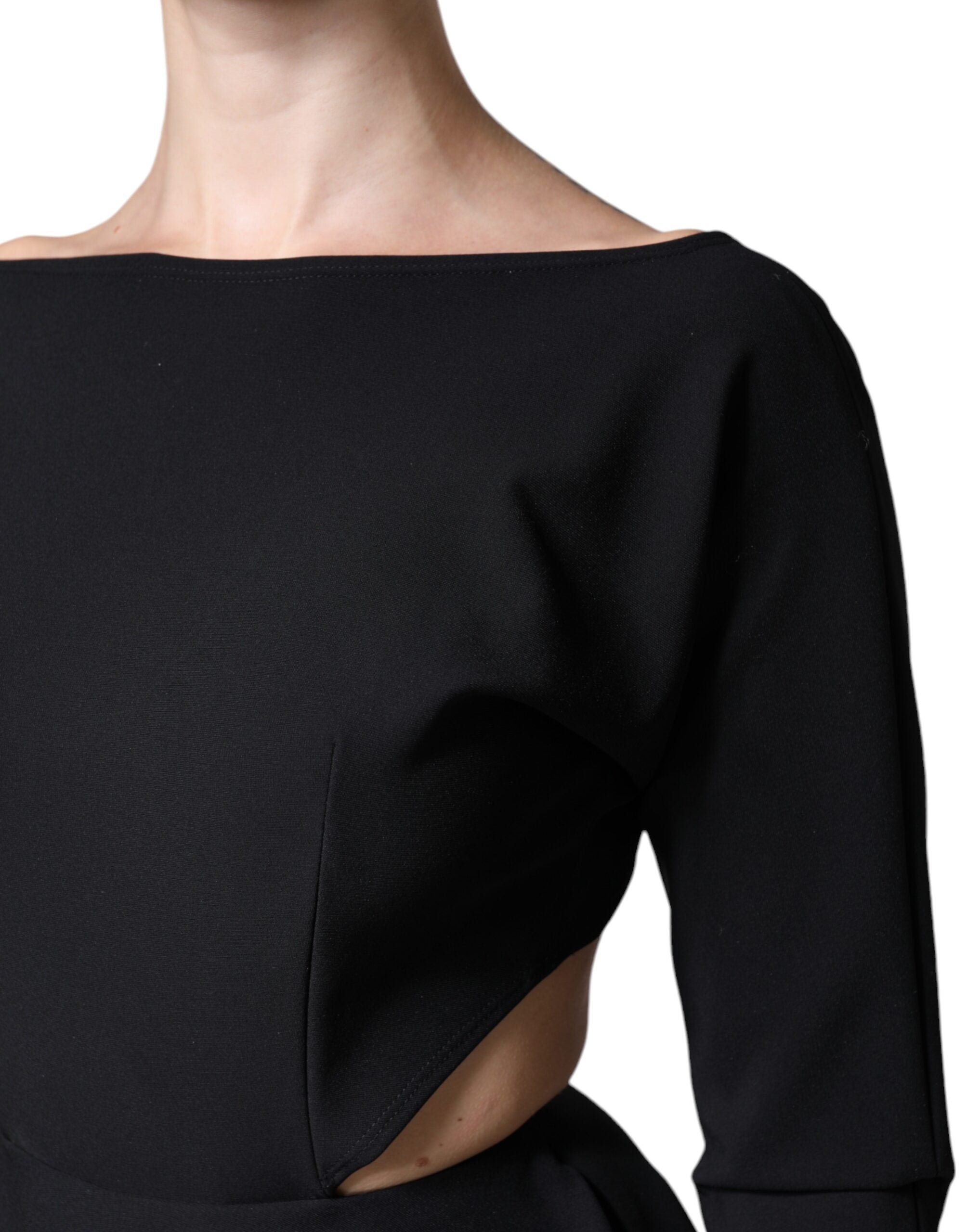 Indulge in the allure of the Dolce & Gabbana Black Viscose Cut Out A-line Long Sleeves Mini Dress, where exquisite craftsmanship meets timeless elegance for the discerning individual.