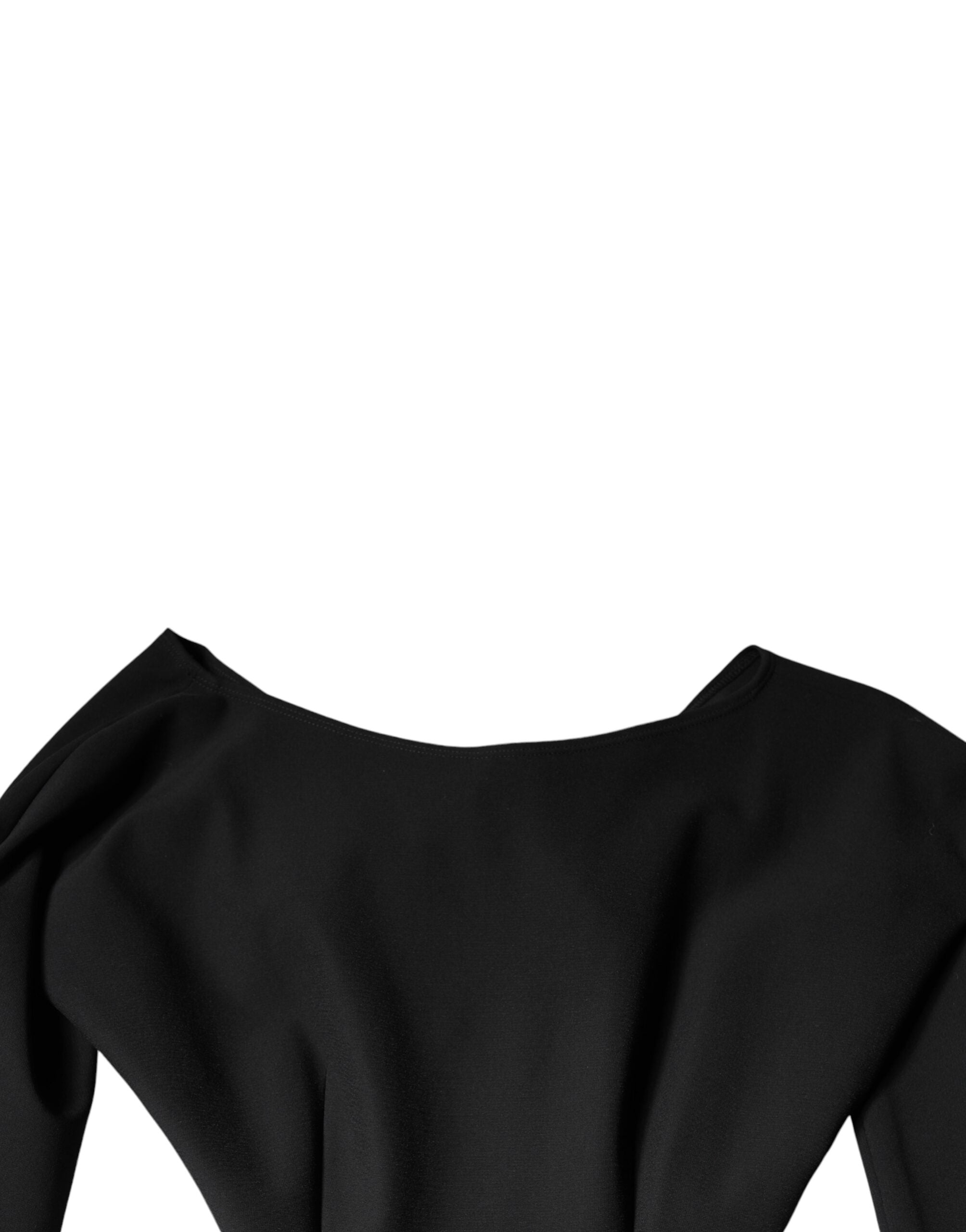 Indulge in the allure of the Dolce & Gabbana Black Viscose Cut Out A-line Long Sleeves Mini Dress, a masterpiece of Italian craftsmanship that embodies timeless elegance and sophistication.