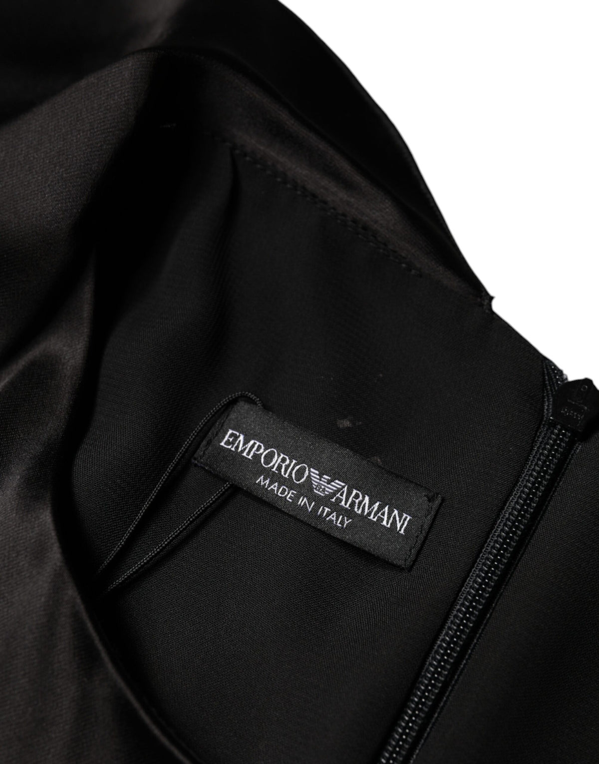 Indulge in the Emporio Armani Black Satin Long Sleeves Wrap Sheath Mini Dress, a masterpiece of Italian craftsmanship that embodies luxury and sophistication for every occasion.
