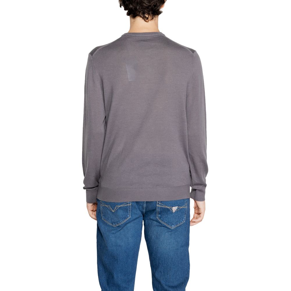 Discover the Armani Exchange Gray Wool Sweatshirt, a masterpiece of luxurious wool and modern elegance, perfect for those who embody sophistication and style.