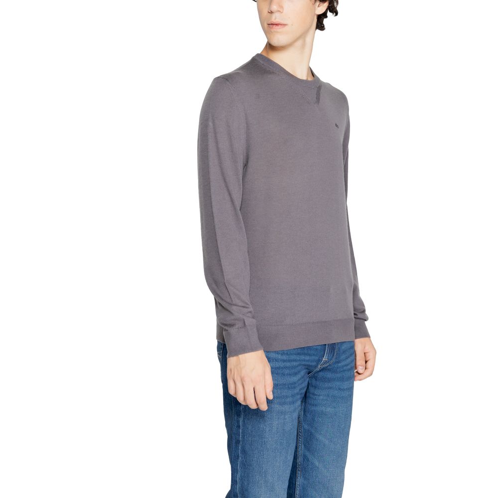 Experience the timeless elegance of the Armani Exchange Gray Wool Sweatshirt, crafted from a luxurious blend of wool and modern sophistication for effortless style.