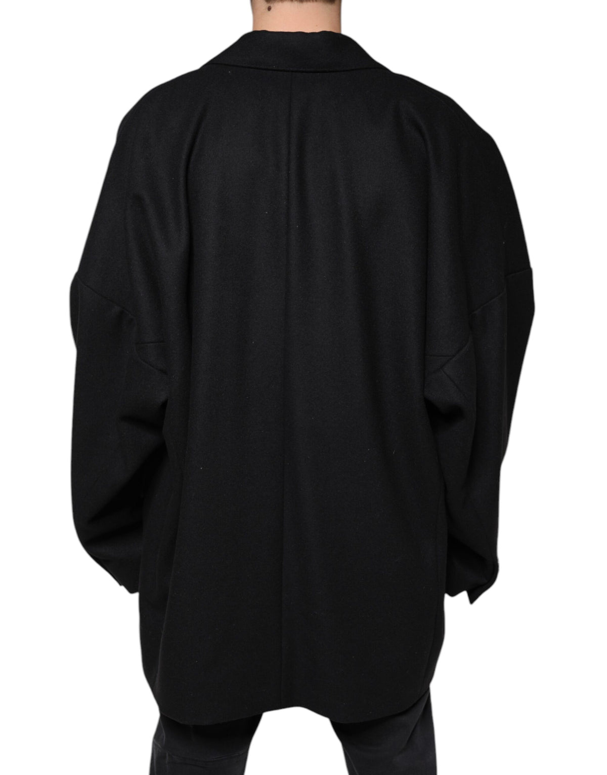 Experience the allure of the Dolce & Gabbana Black Wool Double Breasted Men Coat Jacket, a masterpiece of Italian craftsmanship that defines timeless luxury and sophistication.