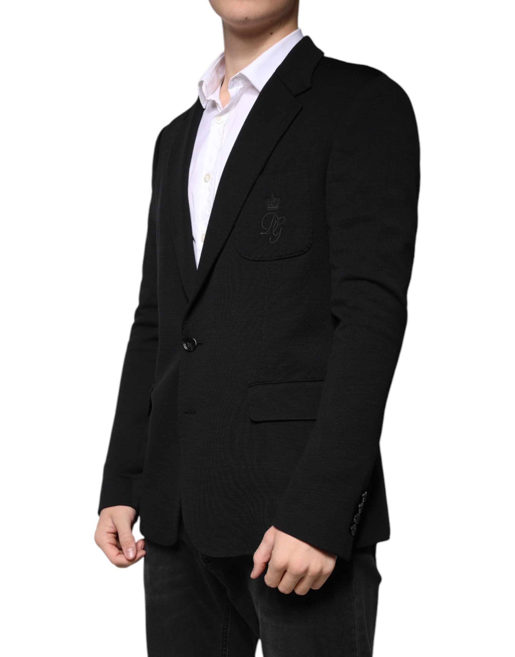 Elevate your style with the Dolce & Gabbana Black Wool Single Breasted Formal Blazer, a masterpiece of Italian craftsmanship that embodies luxury and sophistication.