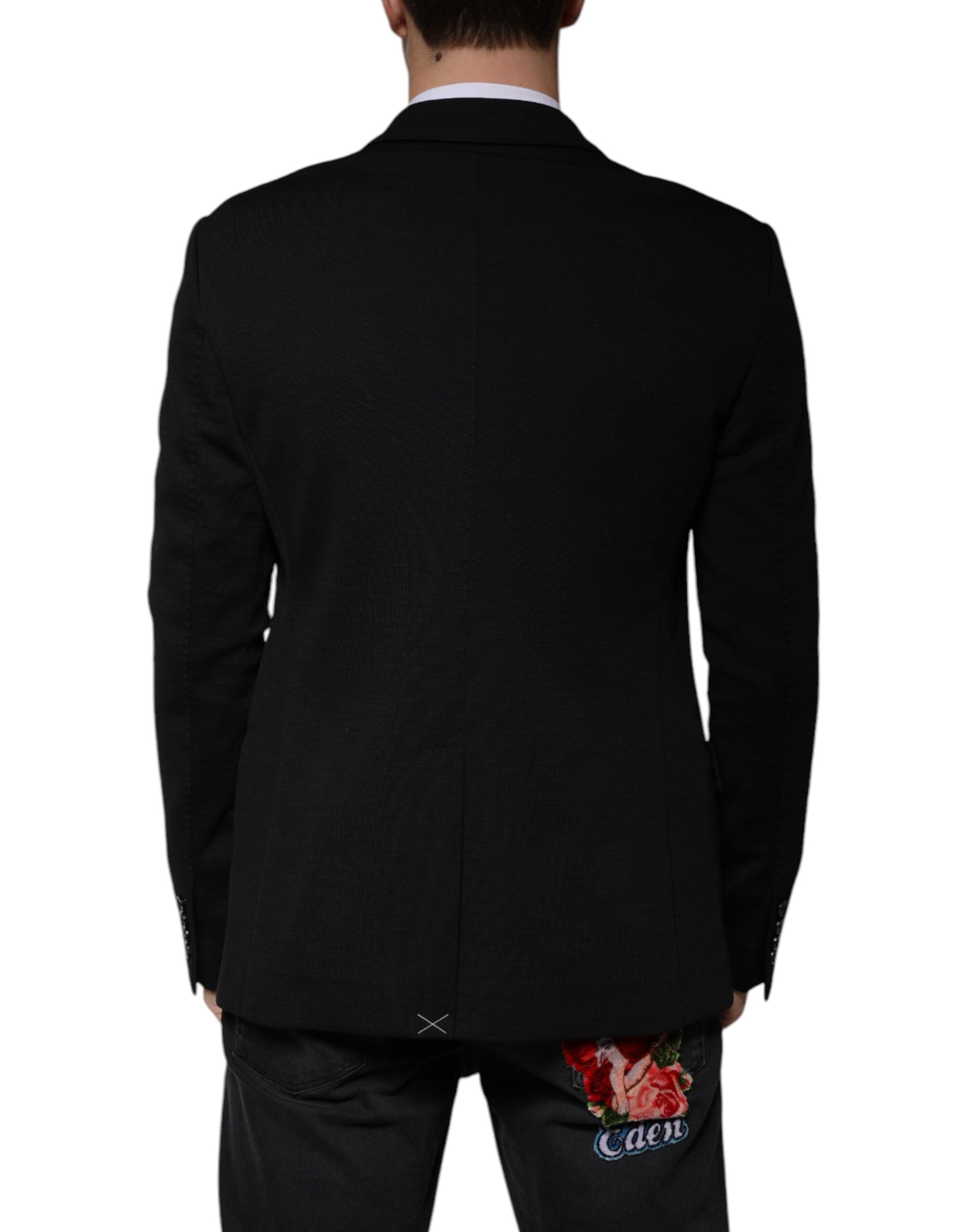Discover the Dolce & Gabbana Black Wool Single Breasted Formal Blazer, a masterpiece of Italian craftsmanship, blending luxury and sophistication for the discerning individual.