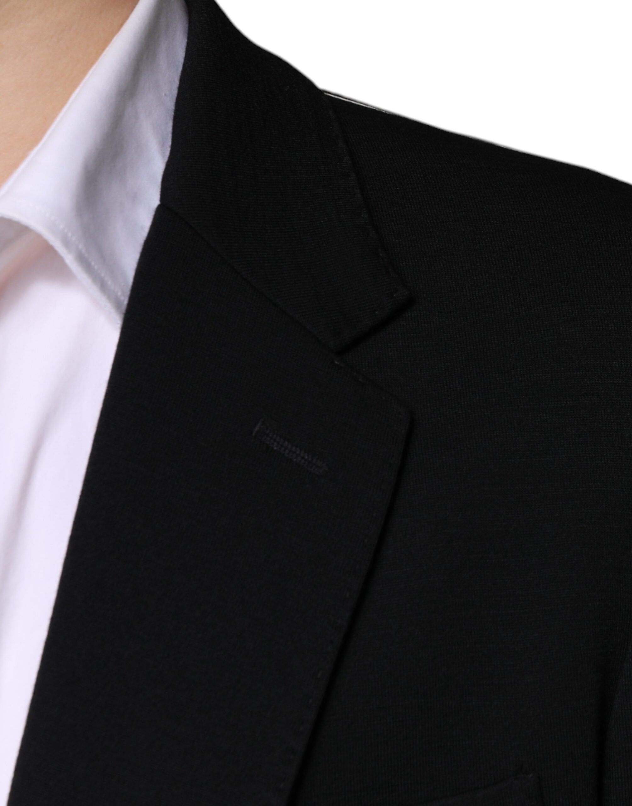 Discover the Dolce & Gabbana Black Wool Single Breasted Formal Blazer, a masterpiece of Italian craftsmanship that exudes timeless elegance and sophistication.