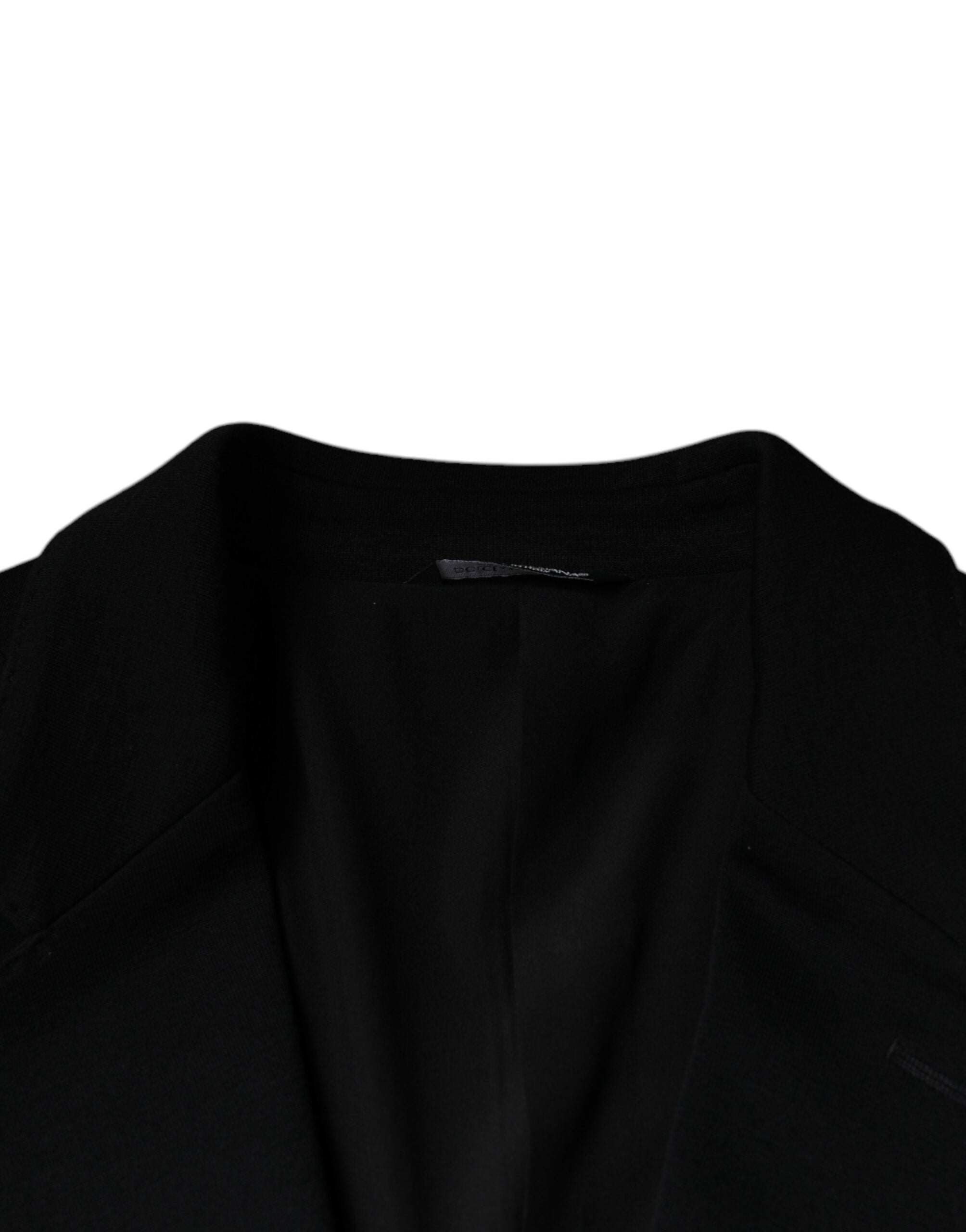 Discover the Dolce & Gabbana Black Wool Single Breasted Formal Blazer, a masterpiece of Italian craftsmanship, blending luxury and sophistication for the discerning individual.