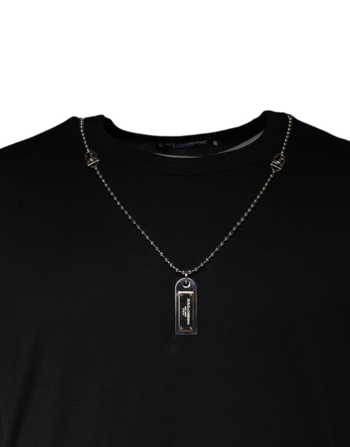 Elevate your wardrobe with the Dolce & Gabbana Black Cotton Necklace Embellished T-shirt, a masterpiece of Italian craftsmanship that seamlessly blends luxury and comfort.