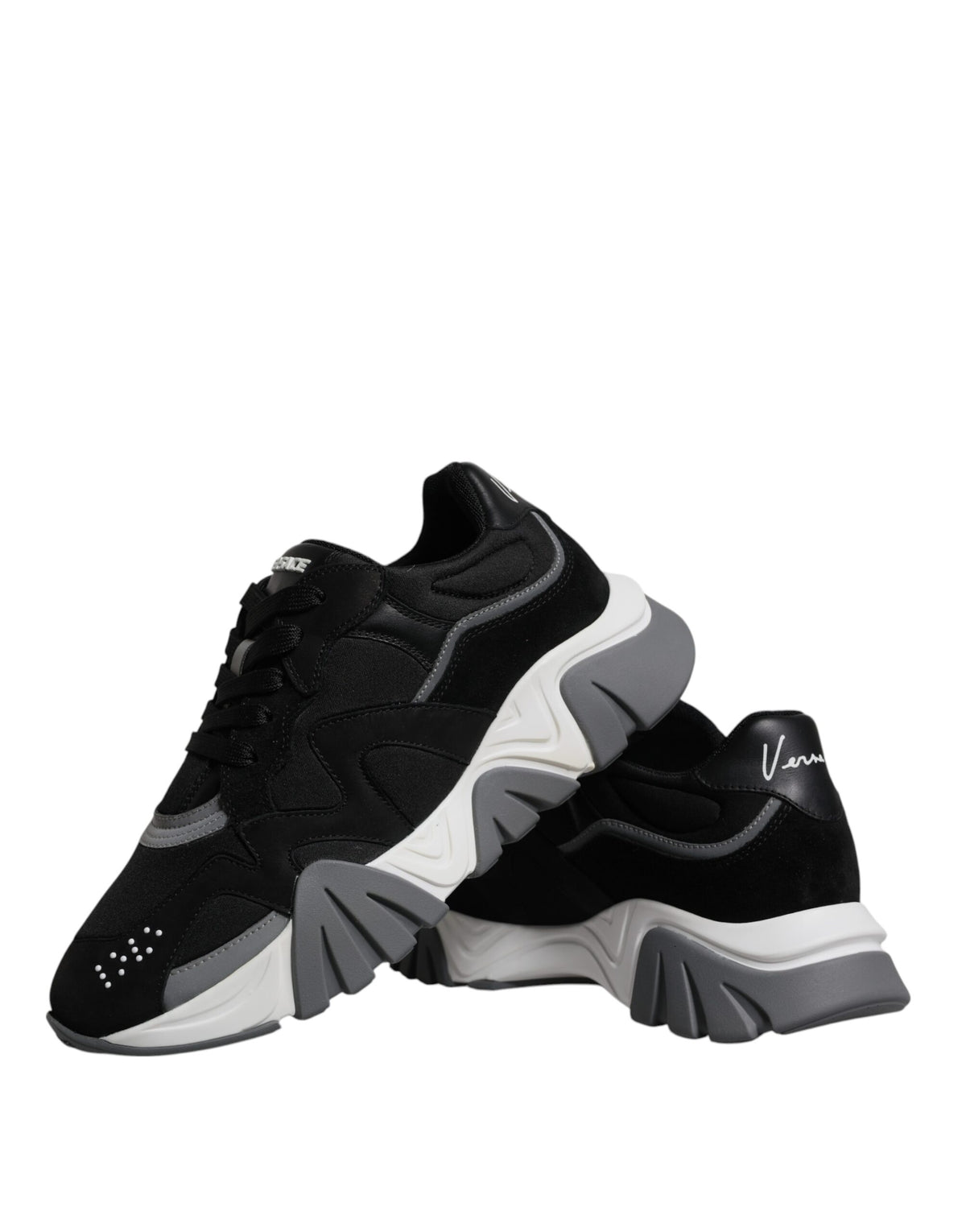 Indulge in the exquisite Versace Black Leather Neoprene Chunky Low Top Sneakers, a luxurious blend of craftsmanship and style, perfect for elevating any ensemble.