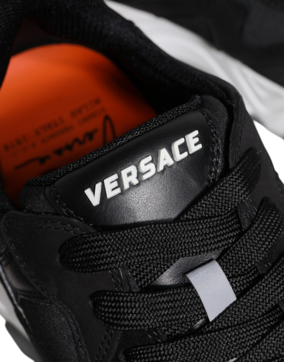 Indulge in the exquisite Versace Black Leather Neoprene Chunky Low Top Sneakers, where Italian craftsmanship meets bold elegance, elevating your style with luxurious allure.