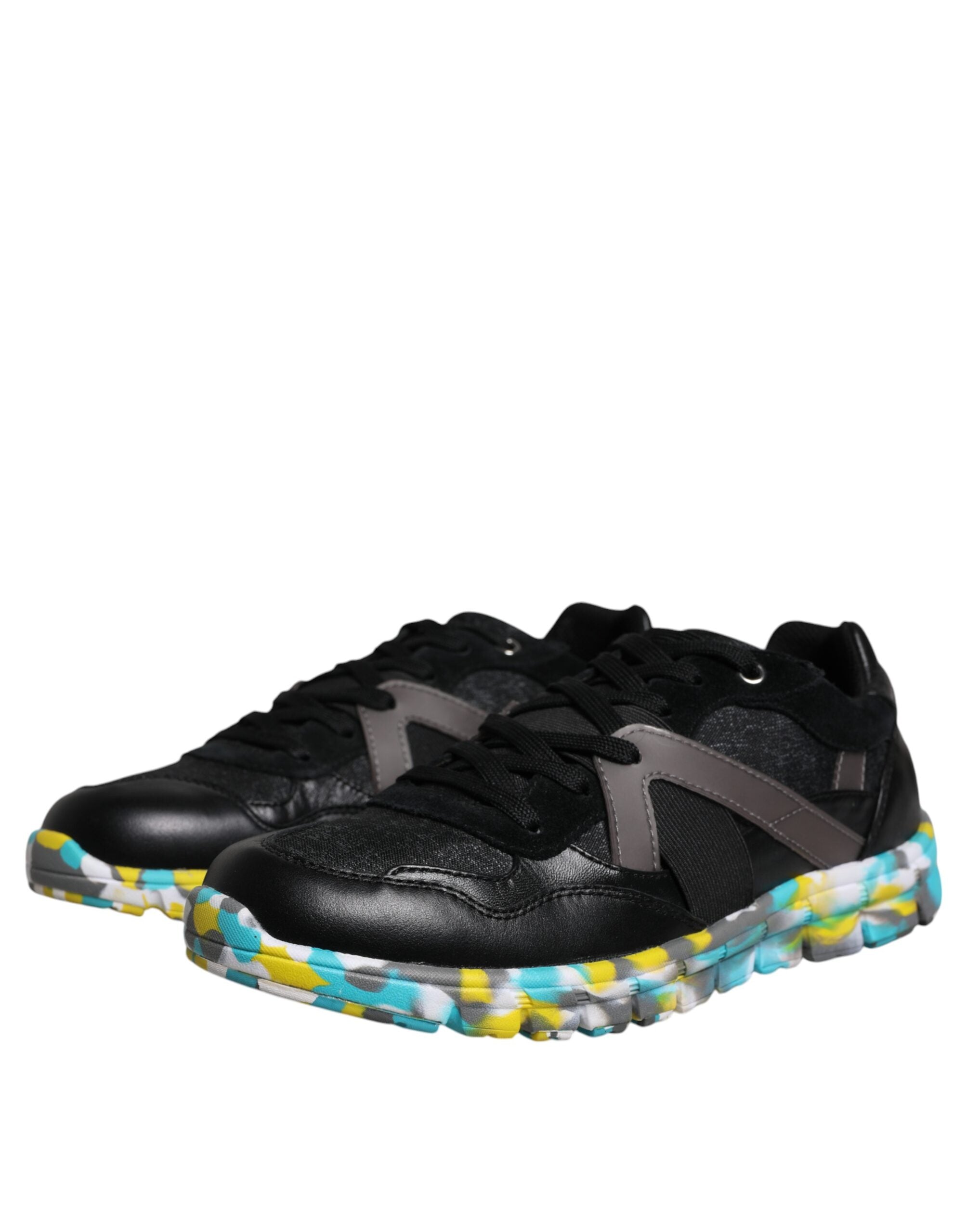Elevate your style with Dolce & Gabbana's Black Polyester Low Top Sneakers, where artisanal craftsmanship meets luxurious materials for an unparalleled statement of sophistication.